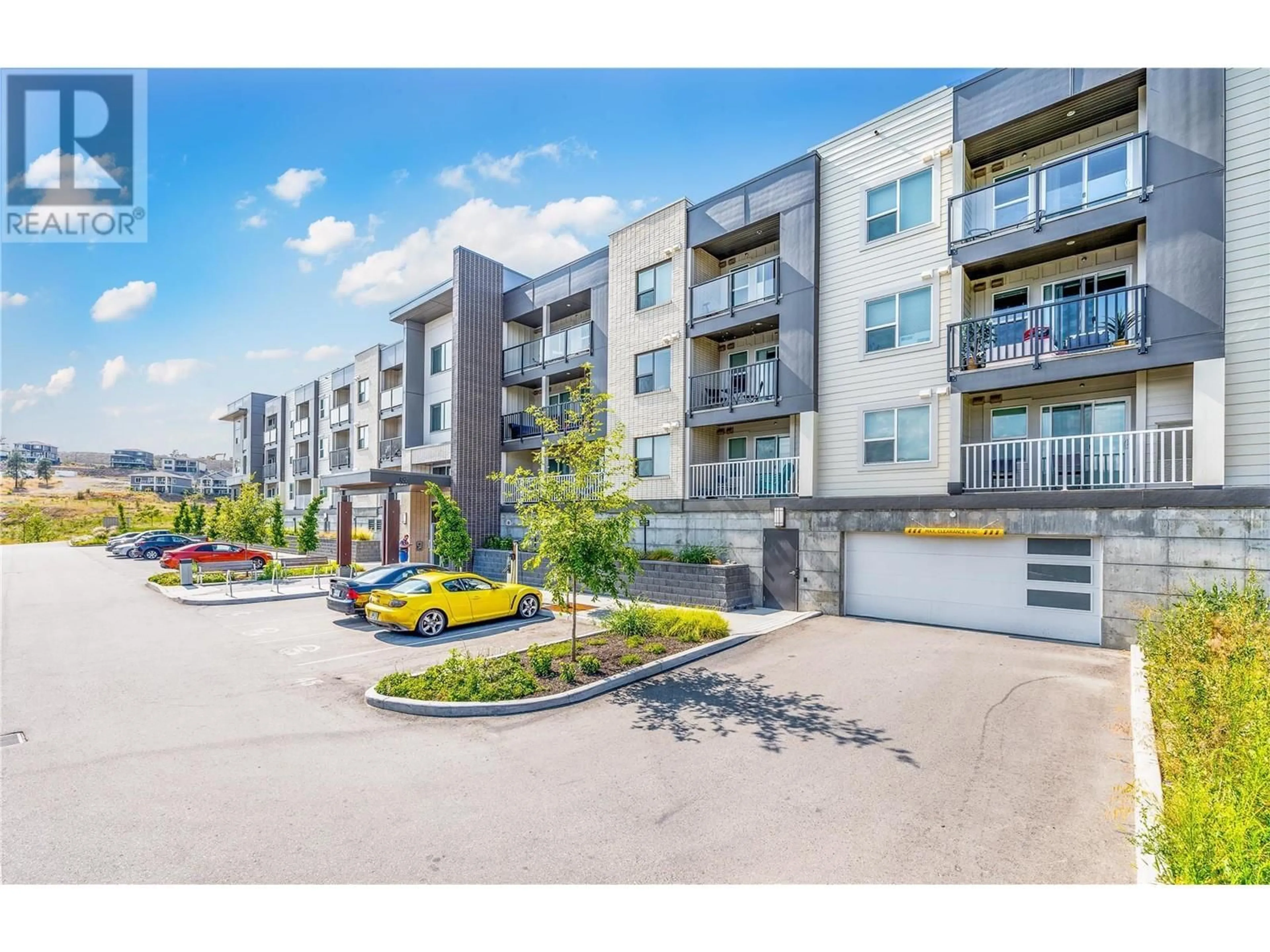A pic from outside/outdoor area/front of a property/back of a property/a pic from drone, street for 216 - 655 ACADEMY WAY, Kelowna British Columbia V1V0A2