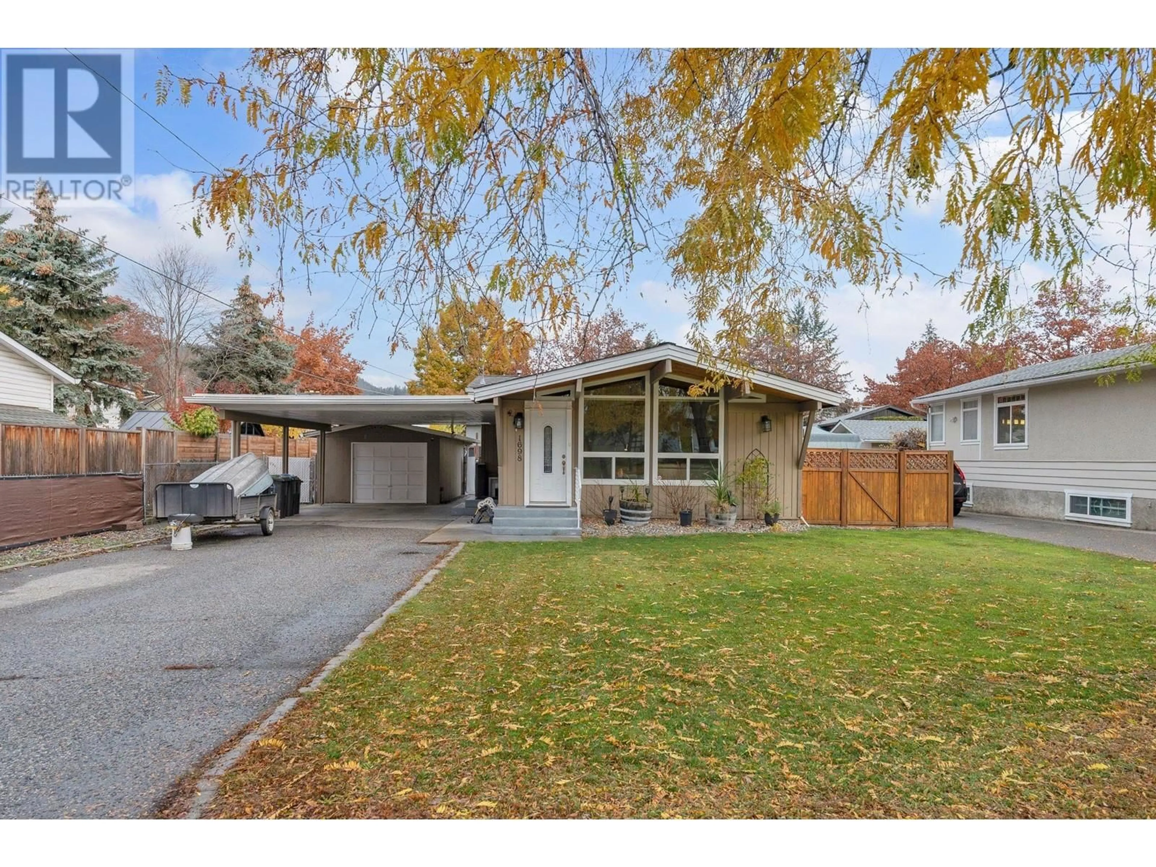 Frontside or backside of a home, the street view for 1698 Gillard Drive, Kelowna British Columbia V1Y4K1