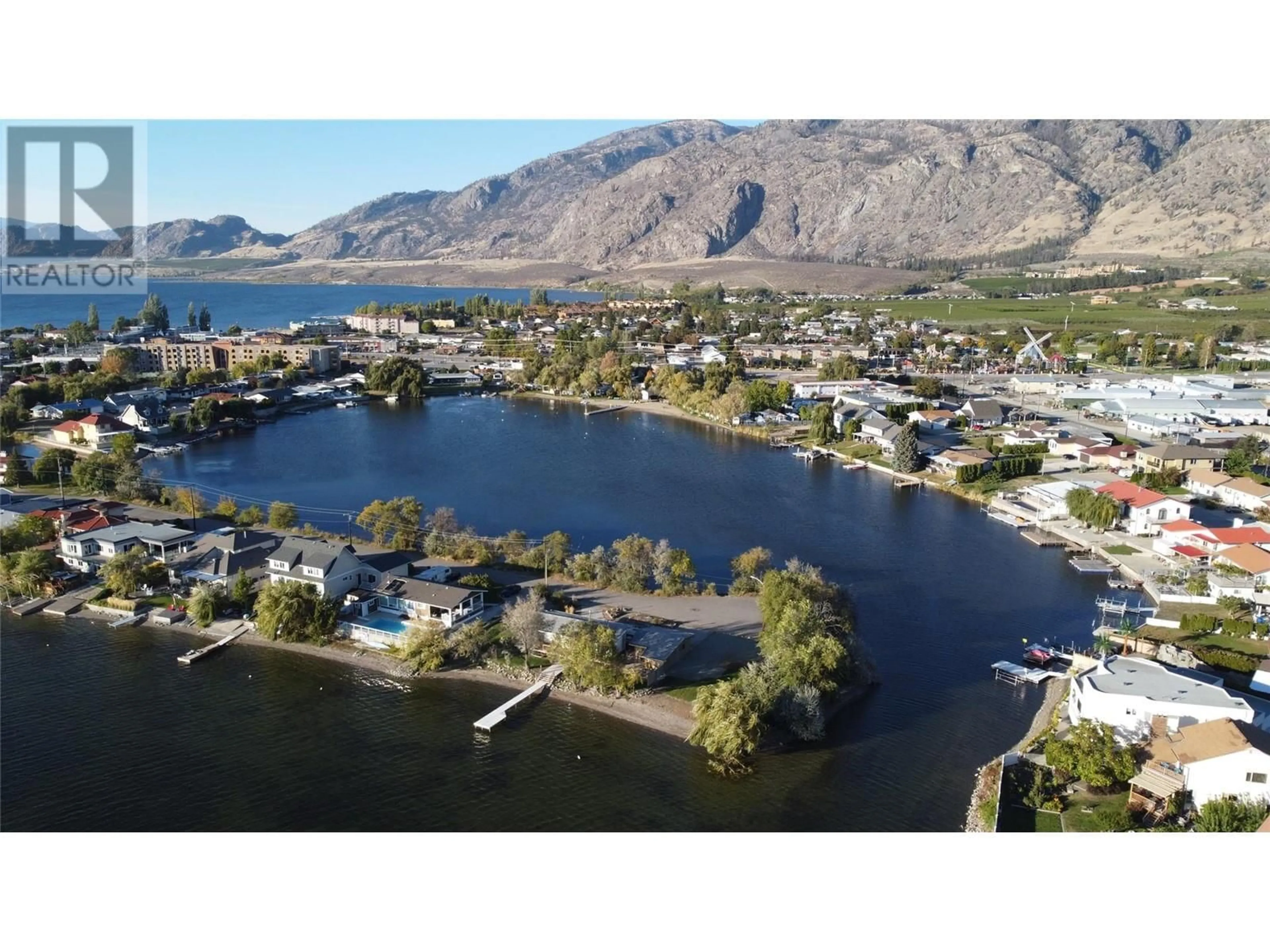 A pic from outside/outdoor area/front of a property/back of a property/a pic from drone, water/lake/river/ocean view for 38 BAYVIEW CRESCENT, Osoyoos British Columbia V0H1V0