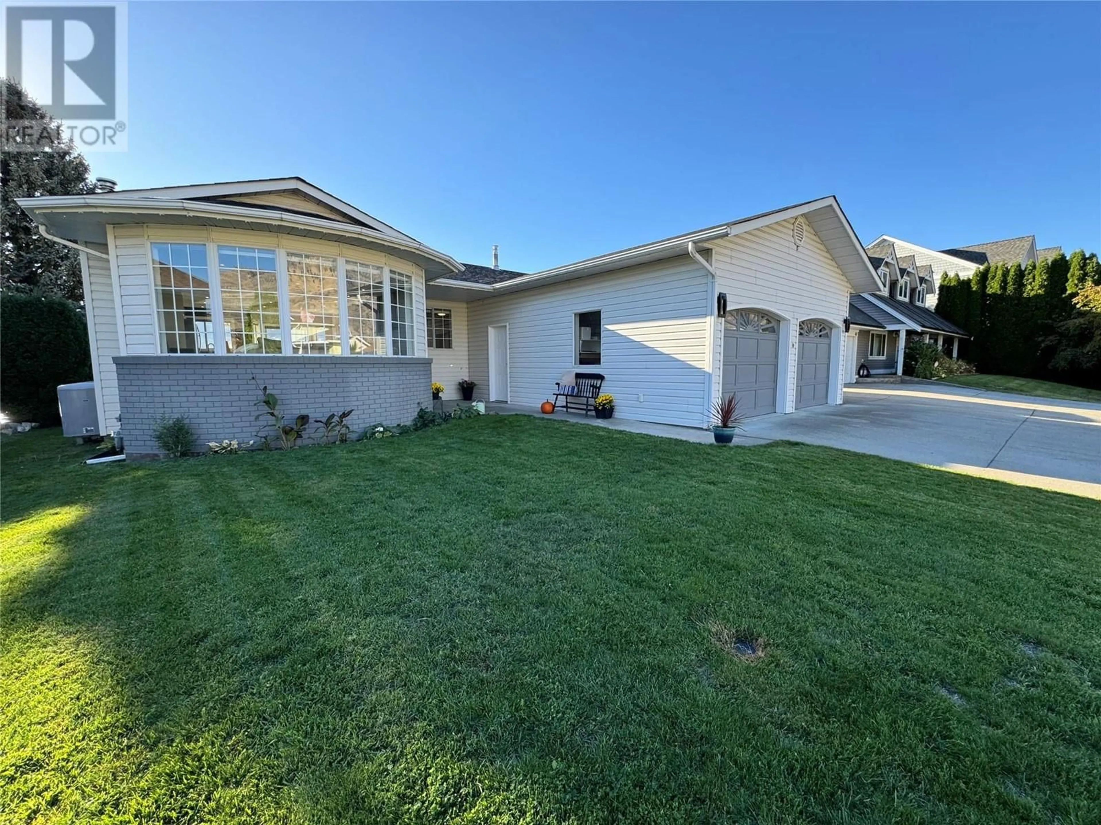 Frontside or backside of a home, the fenced backyard for 38 Bayview Crescent, Osoyoos British Columbia V0H1V0