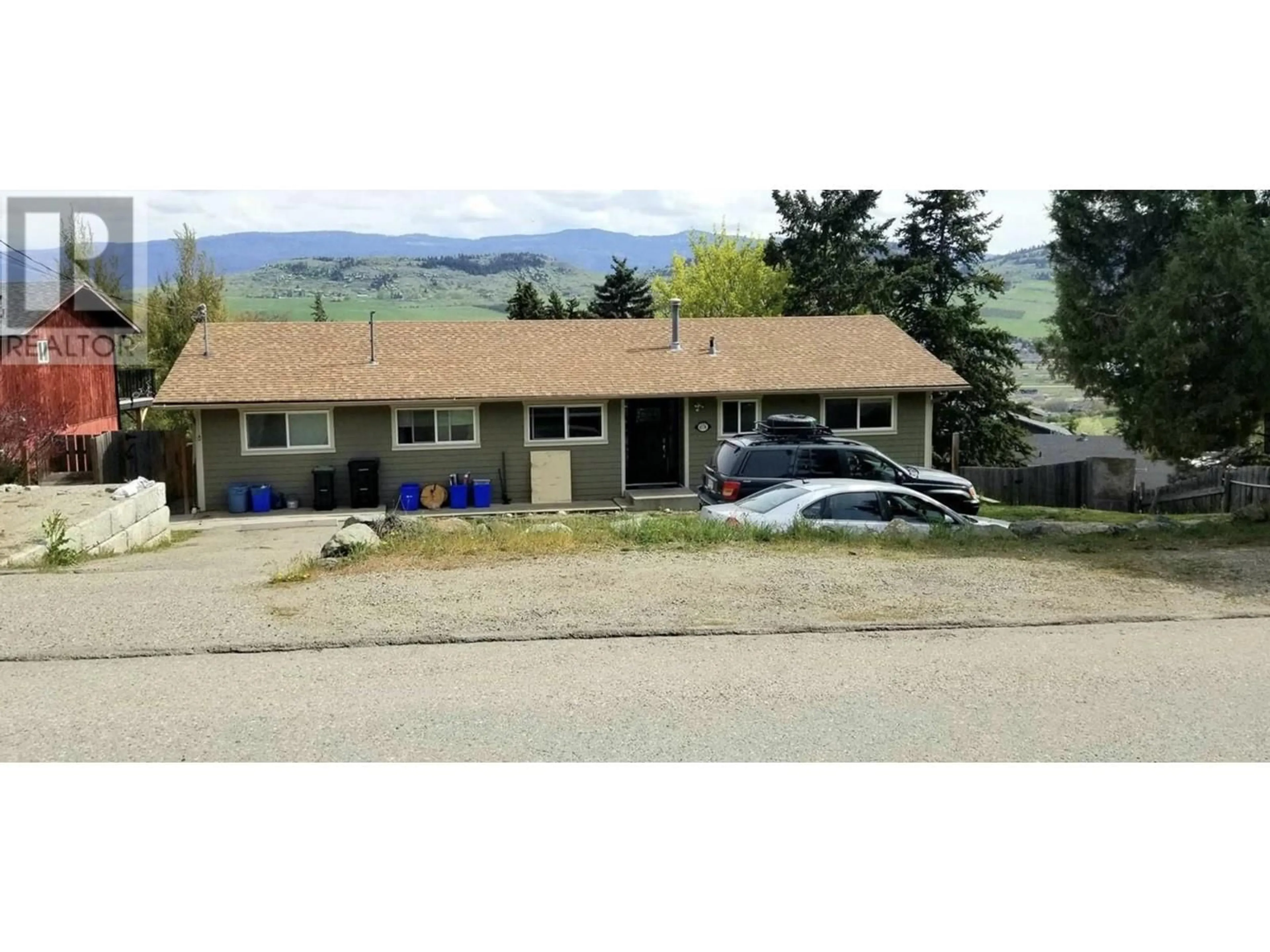 Frontside or backside of a home, the street view for 6576 Southwind Road, Vernon British Columbia V1H1B7