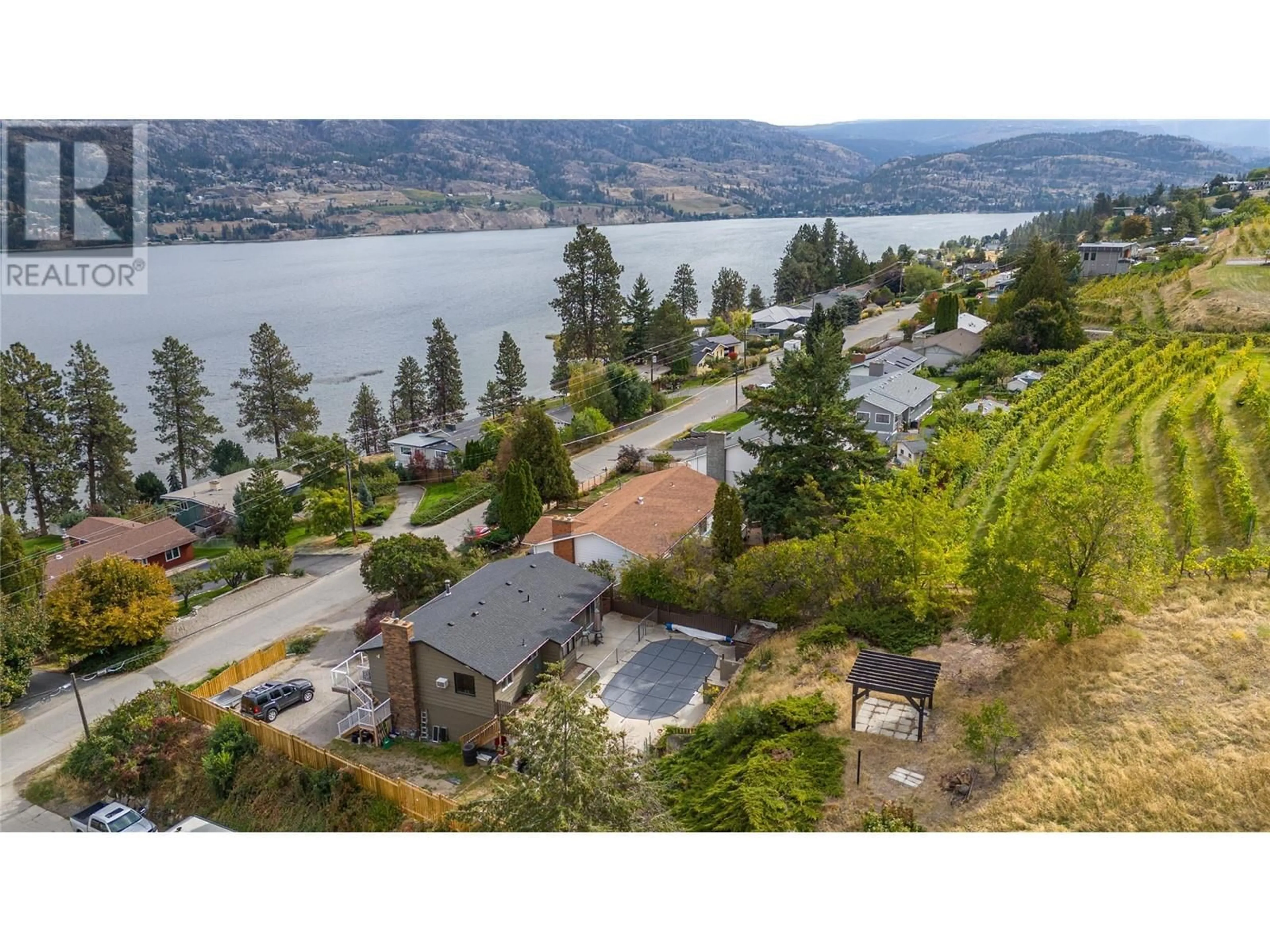 A pic from outside/outdoor area/front of a property/back of a property/a pic from drone, water/lake/river/ocean view for 545 Pineview Drive, Kaleden British Columbia V0H1K0