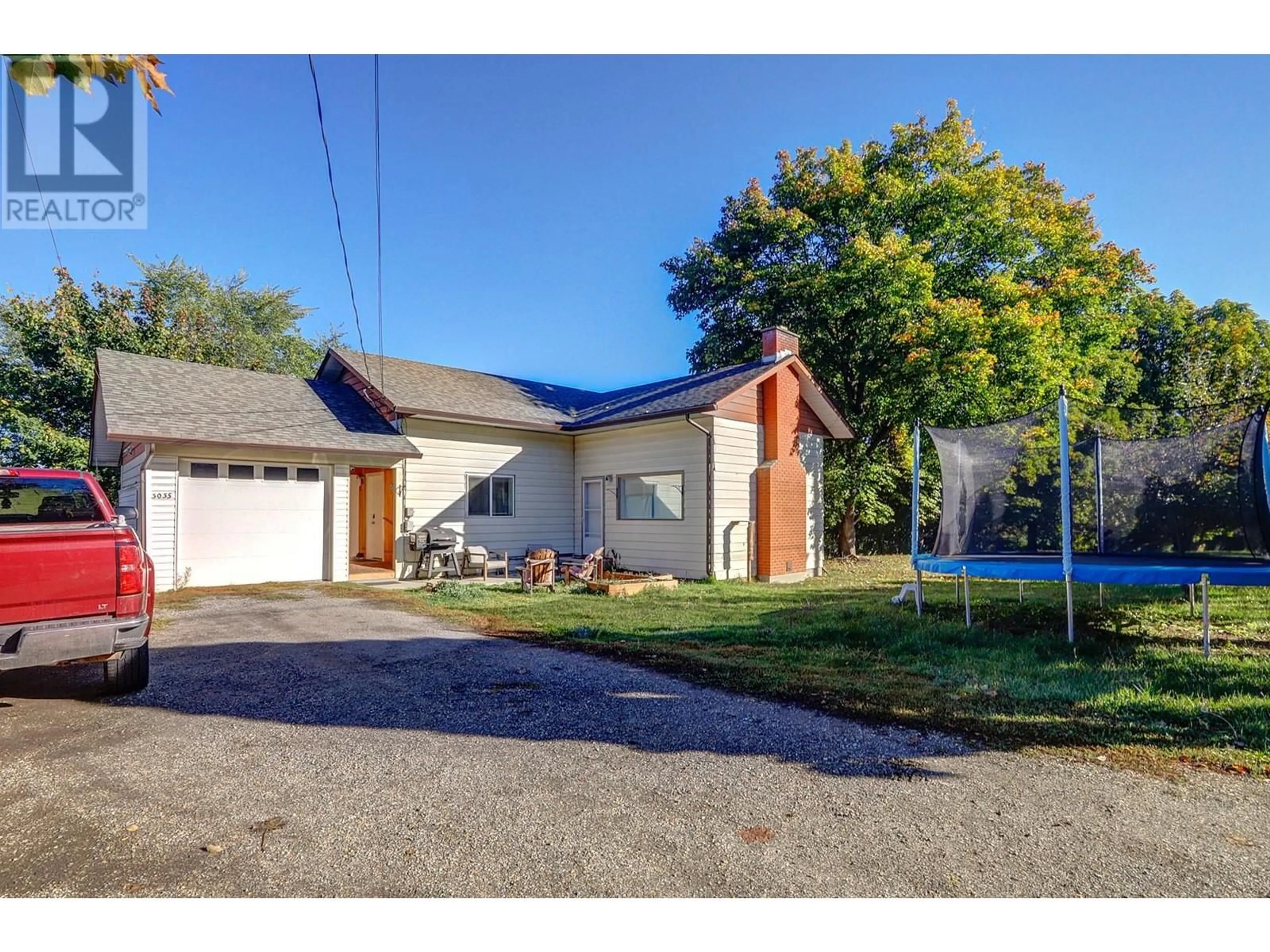 Frontside or backside of a home, the street view for 3035 Pleasant Valley Road, Armstrong British Columbia V4Y0J3