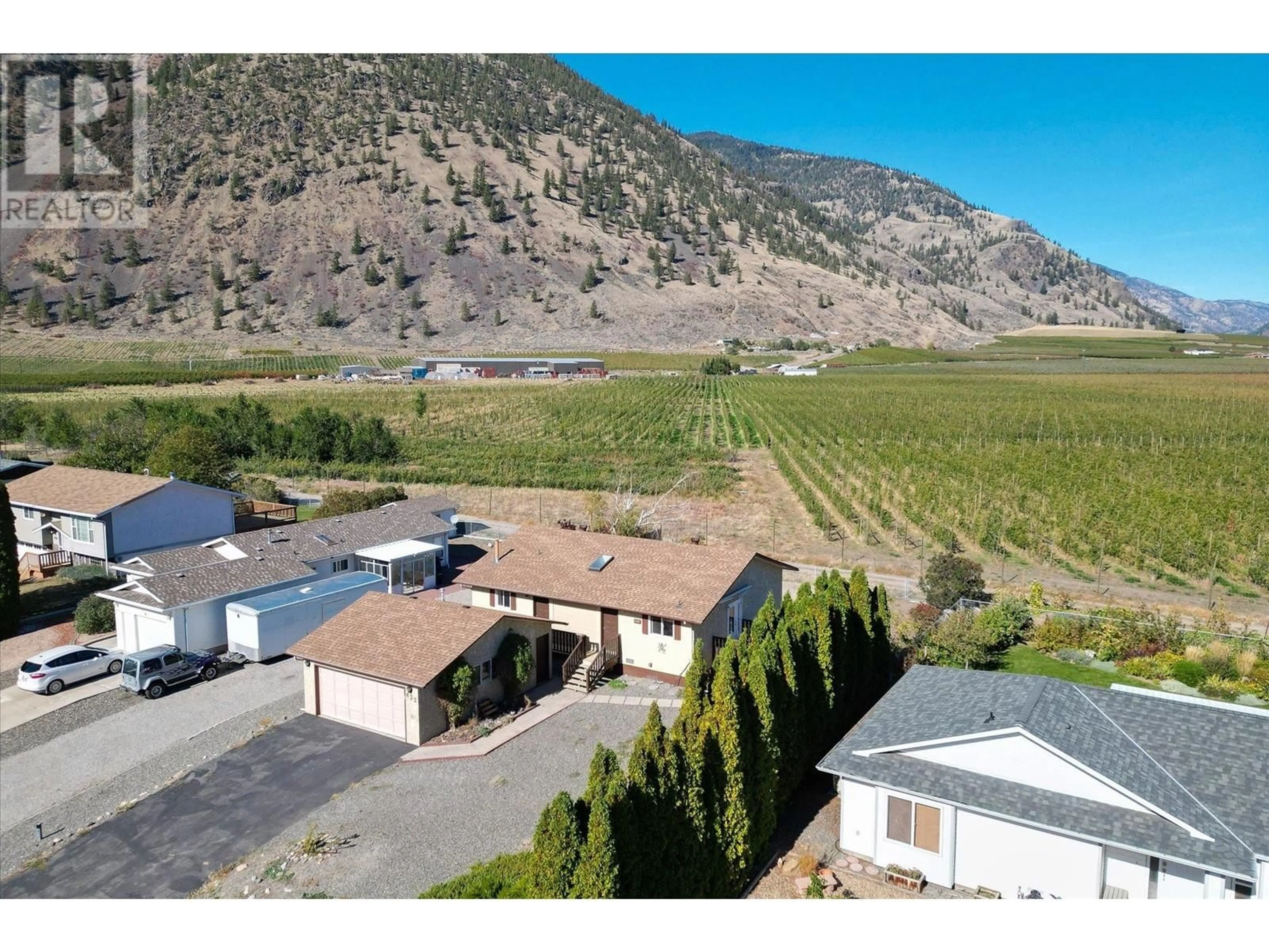 A pic from exterior of the house or condo, the fenced backyard for 422 Vanderlinde Drive, Keremeos British Columbia V0X1N2