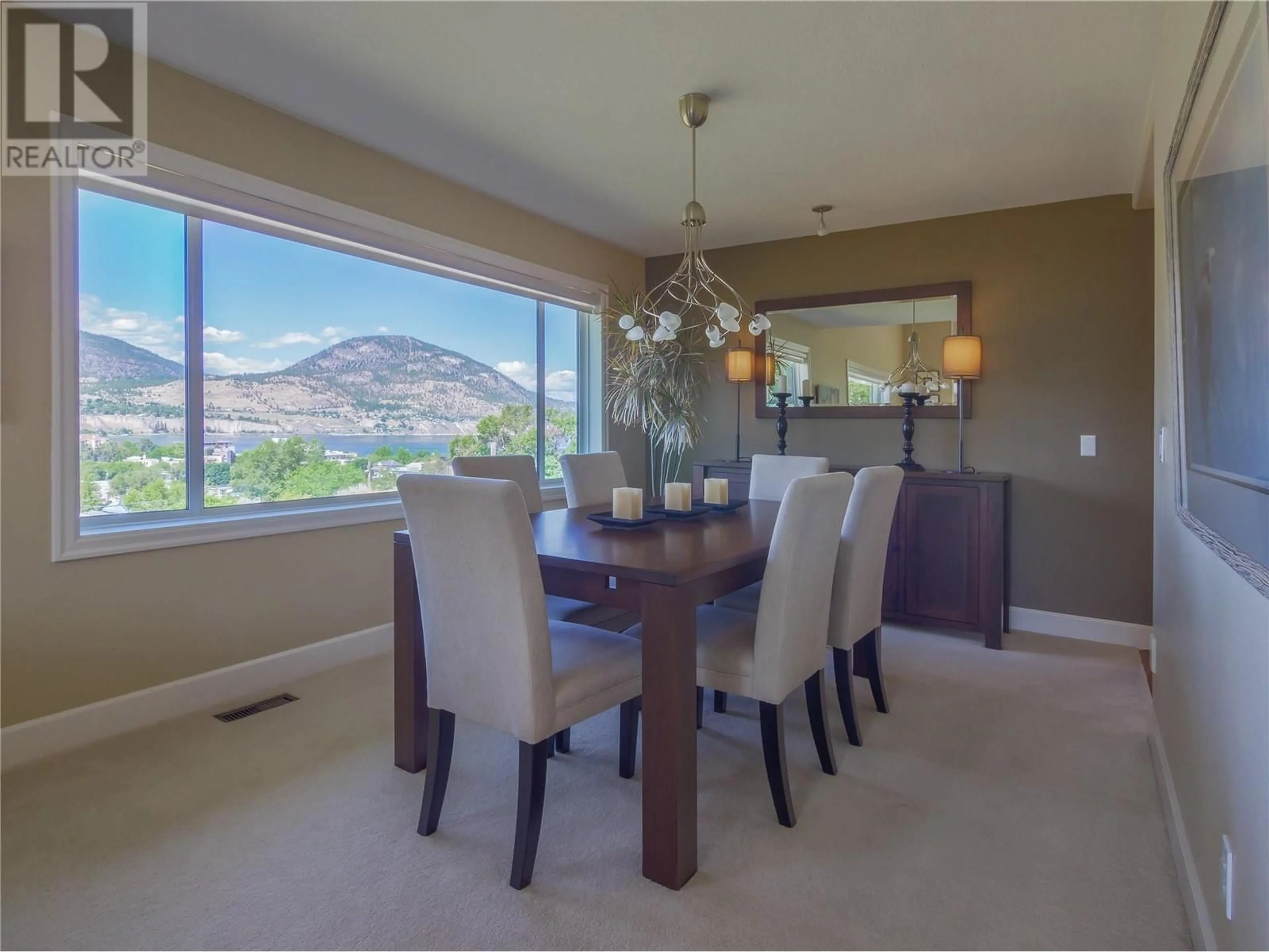 Dining room, wood floors, mountain for 501 Nanaimo Avenue E, Penticton British Columbia V2A1M8