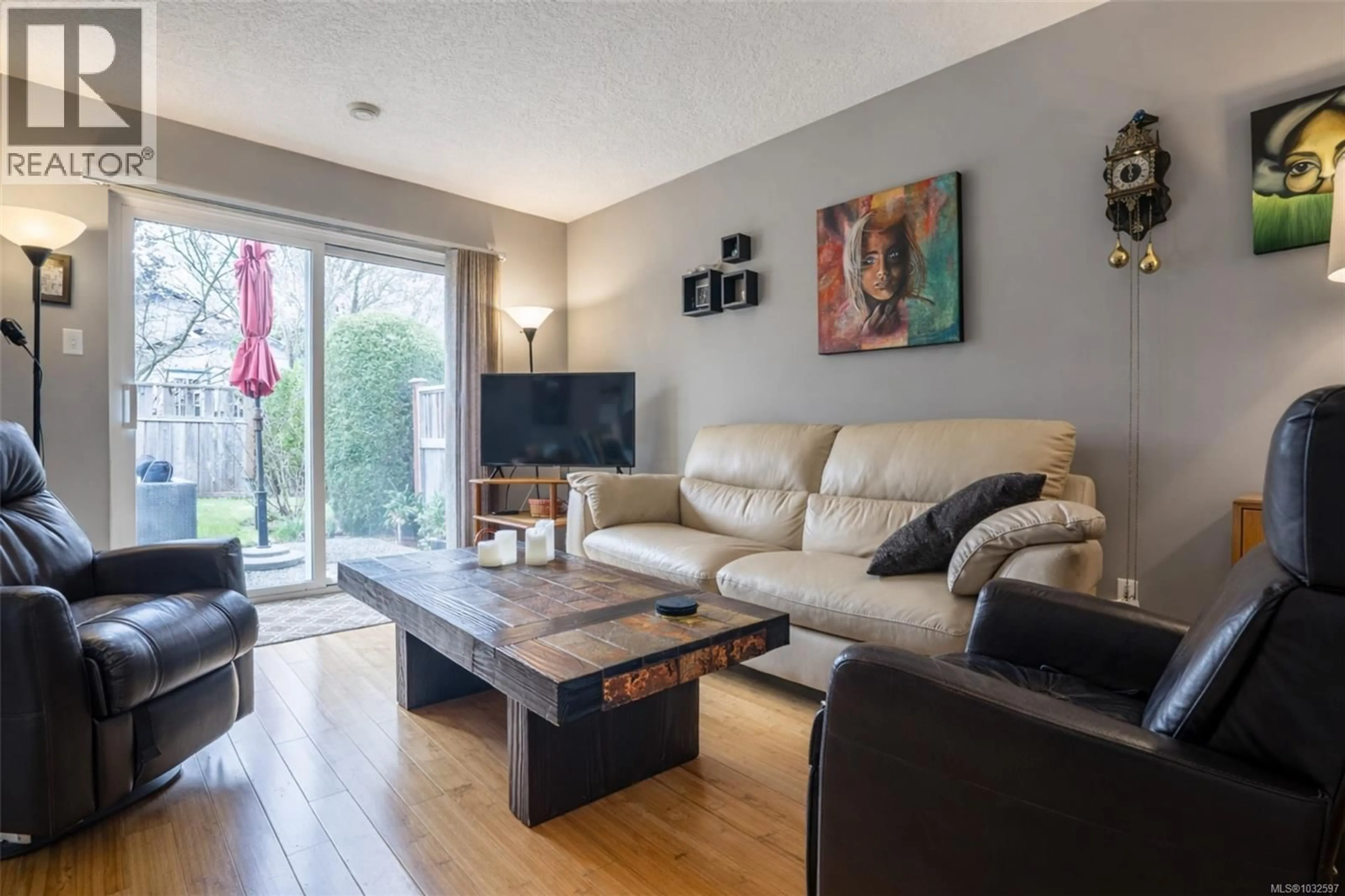 Living room with furniture, wood/laminate floor for 1771 BAY STREET, Victoria British Columbia V8R2B9