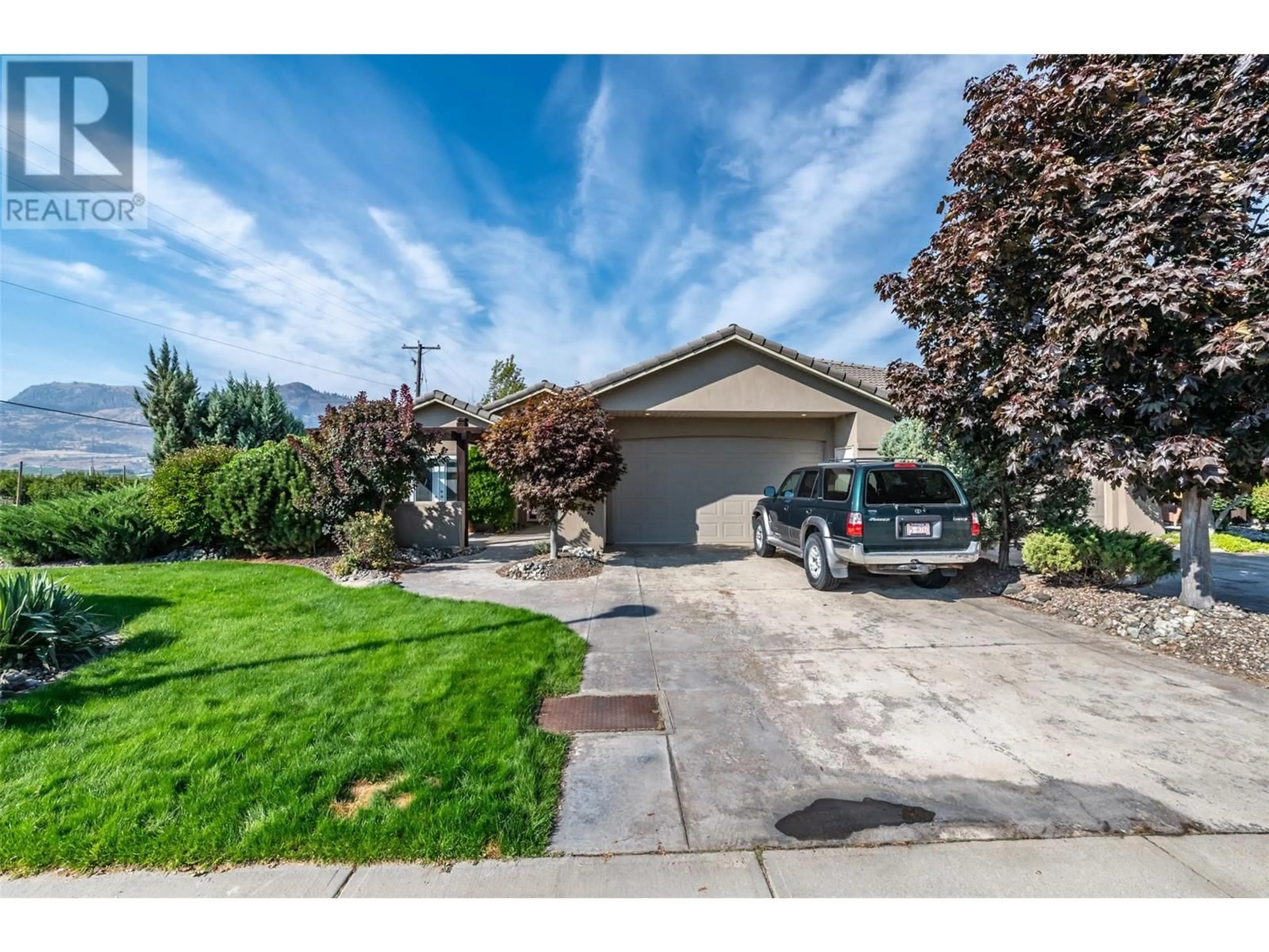 Frontside or backside of a home, the street view for 3200 Lobelia Drive, Osoyoos British Columbia V0H1V1