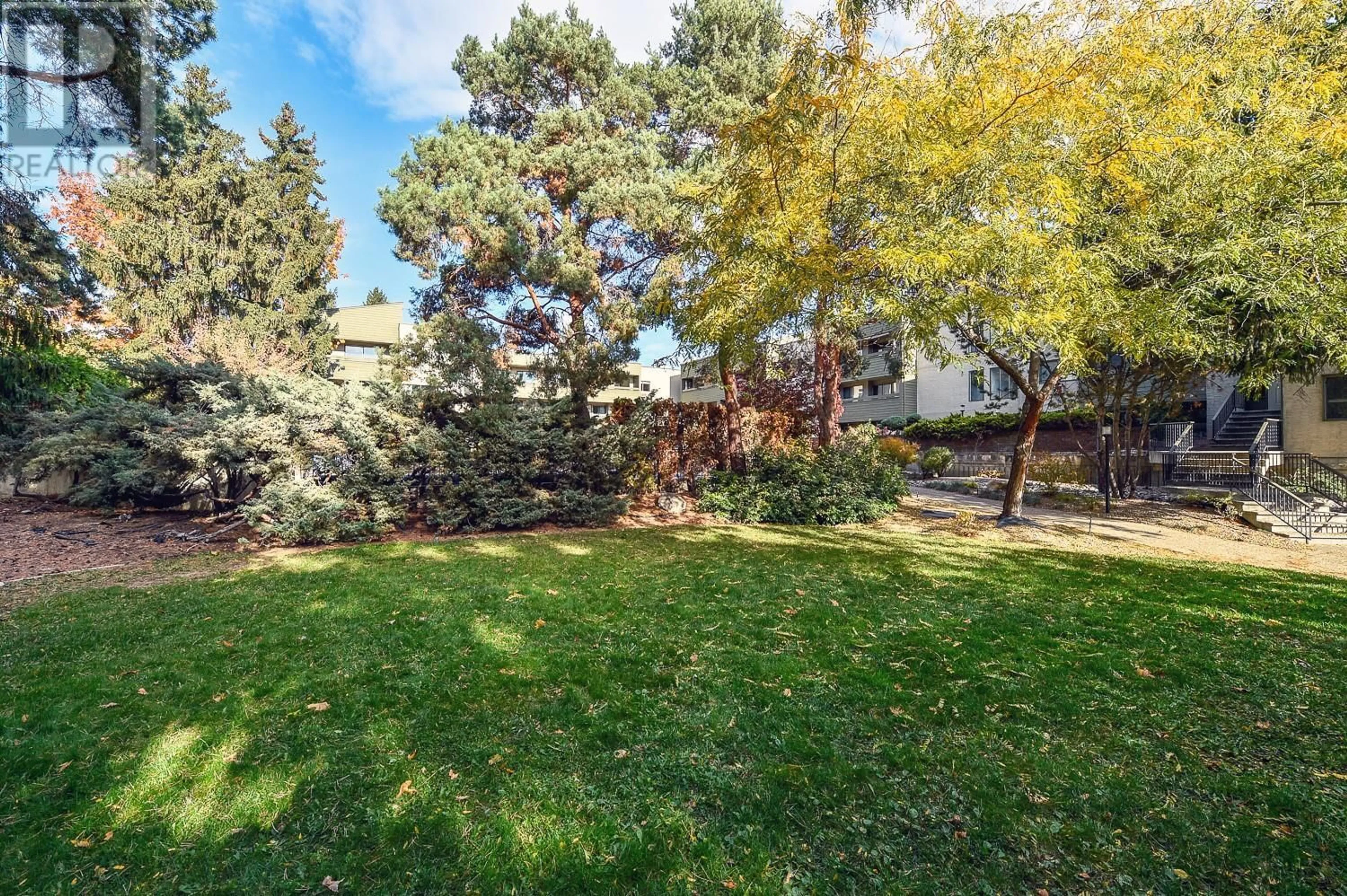 A pic from outside/outdoor area/front of a property/back of a property/a pic from drone, forest/trees view for 1056 Bernard Avenue Unit# 313, Kelowna British Columbia V1Y8L7