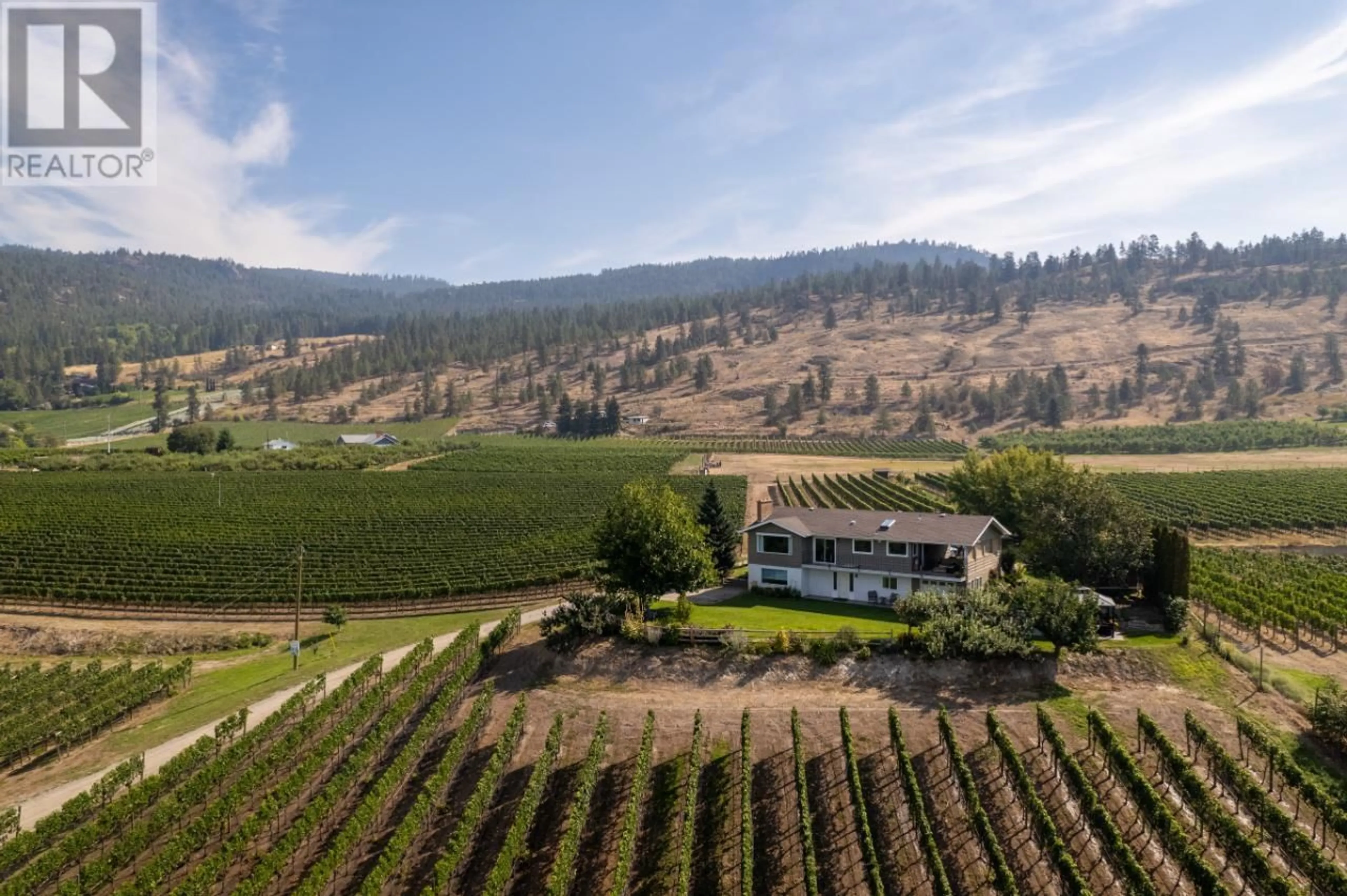 A pic from outside/outdoor area/front of a property/back of a property/a pic from drone, mountain view for 1116 NARAMATA ROAD, Penticton British Columbia V2A8T6