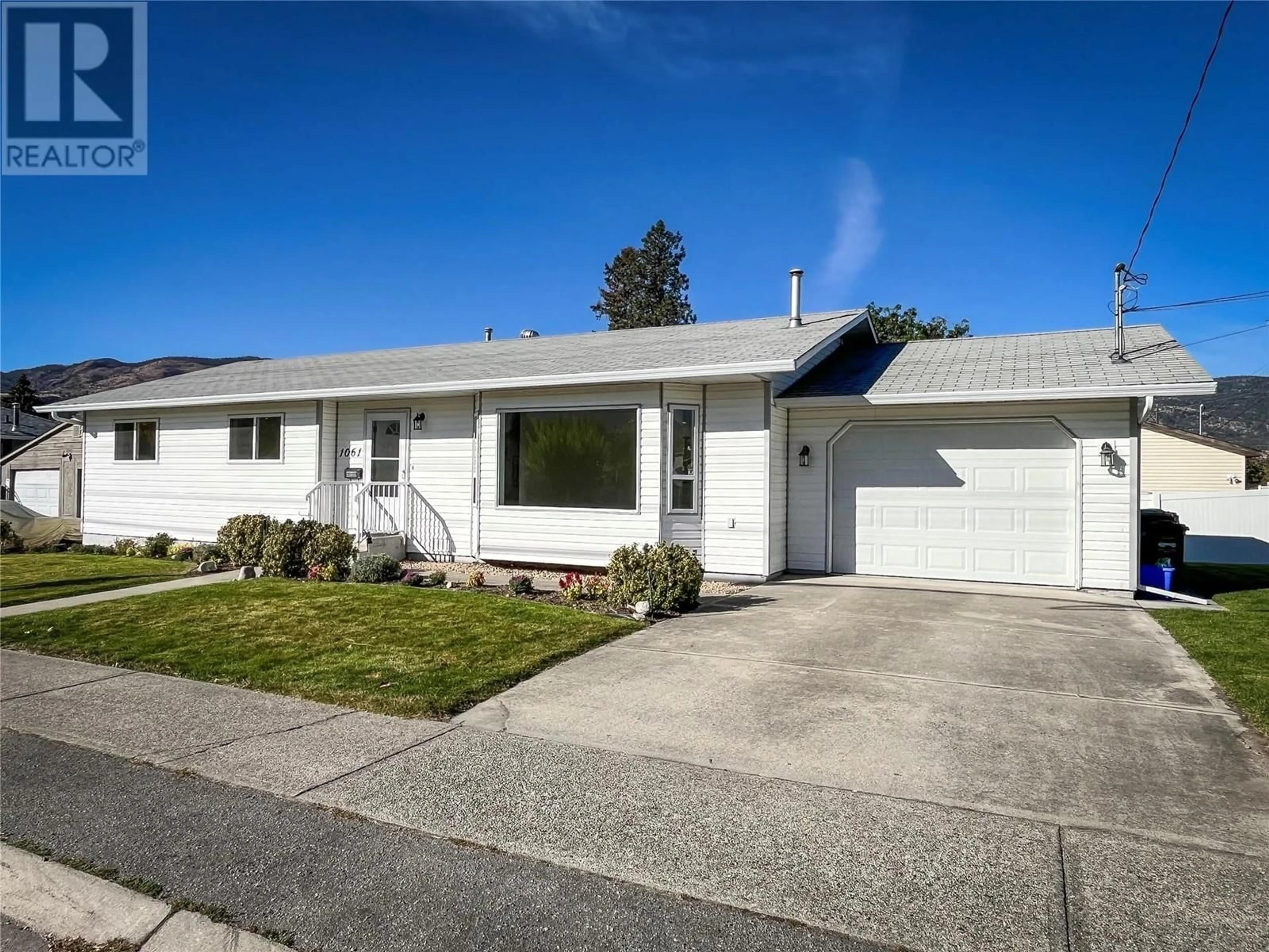 Frontside or backside of a home, the street view for 1061 Argyle Street, Penticton British Columbia V2A5P3