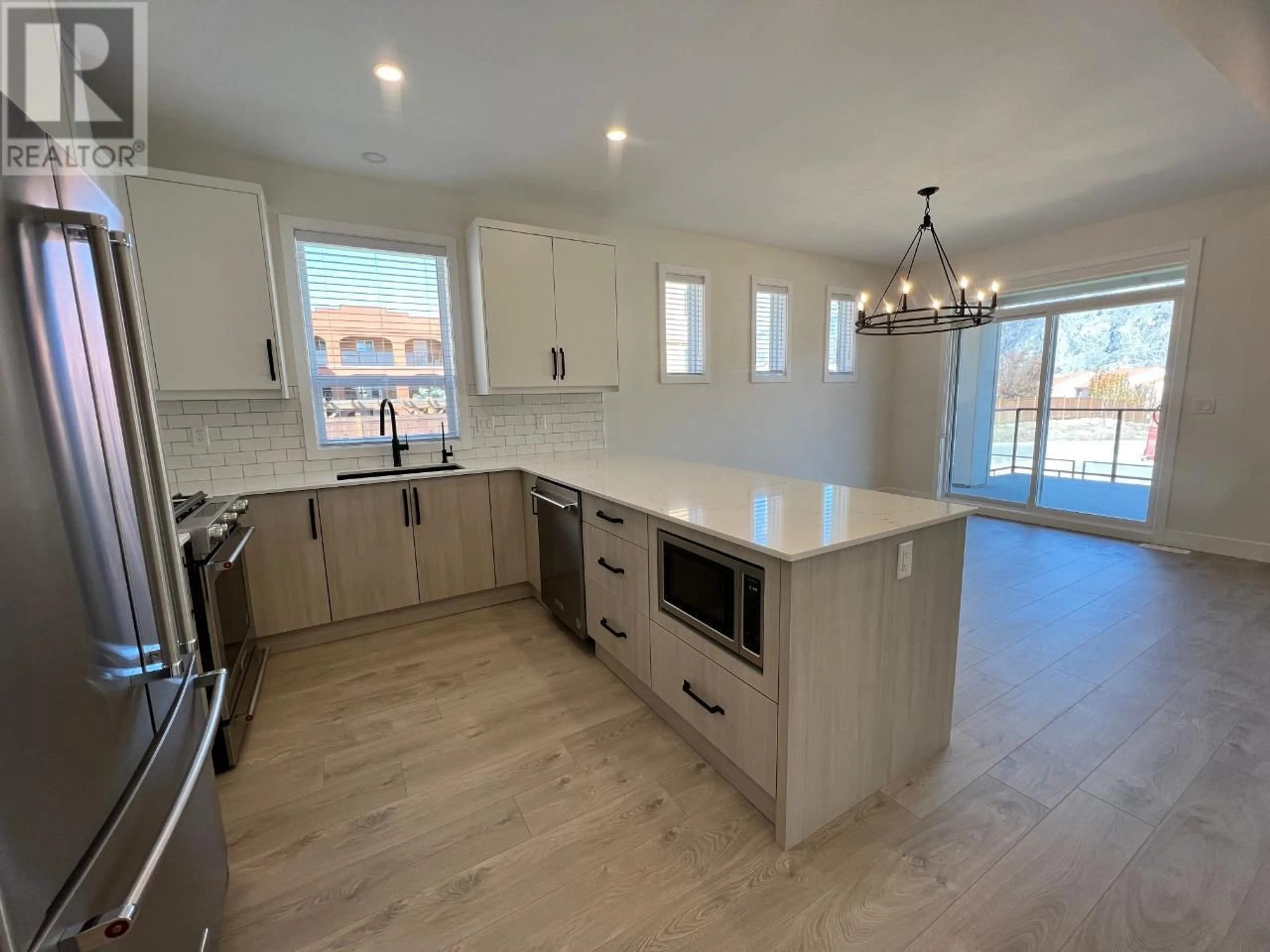 Open concept kitchen for 8000 VEDETTE Drive Unit# 23, Osoyoos British Columbia V0H1V2