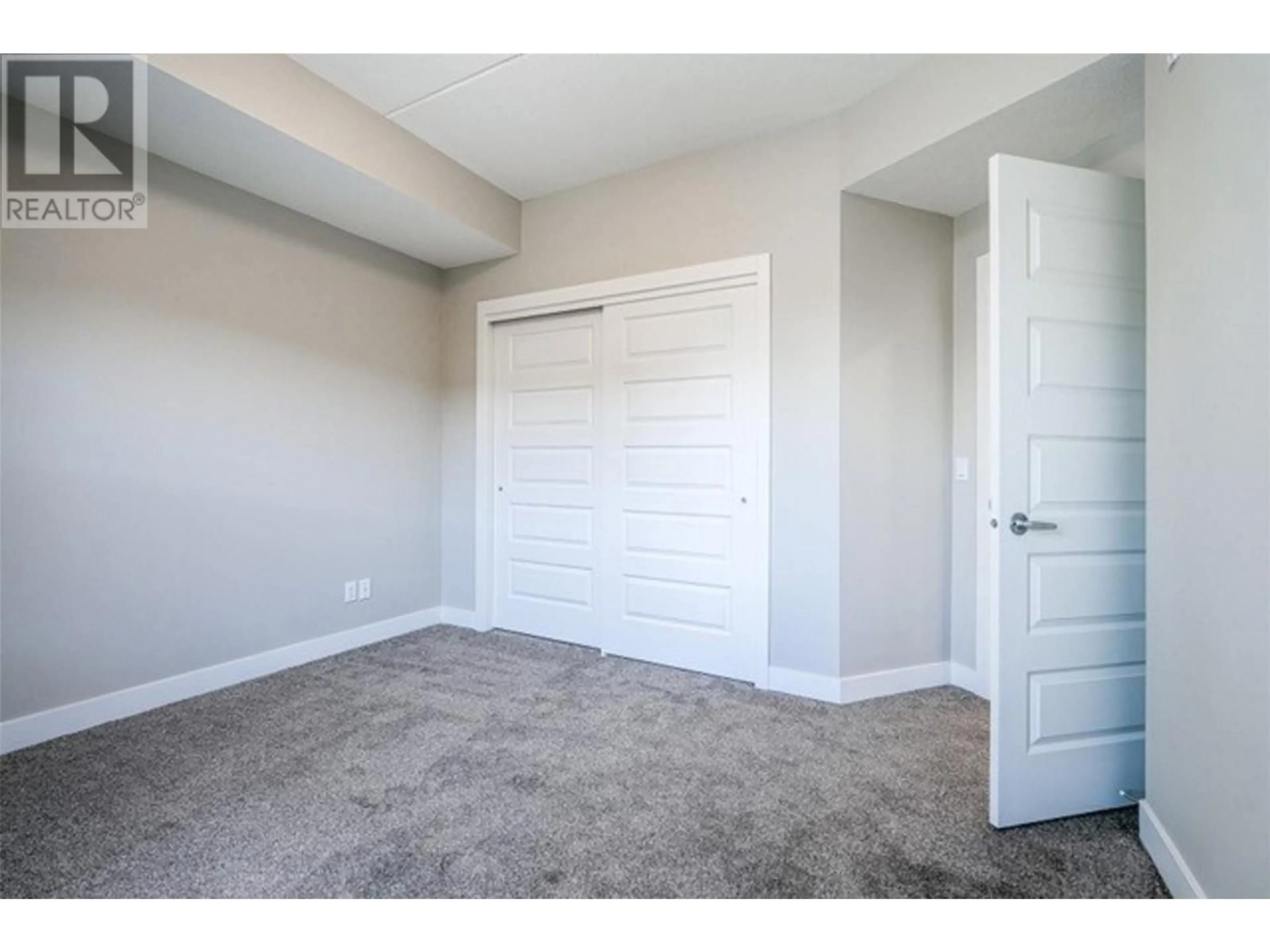 A pic of a room, carpet floors for 306 5620 - 51st Street, Osoyoos British Columbia V0H1V6