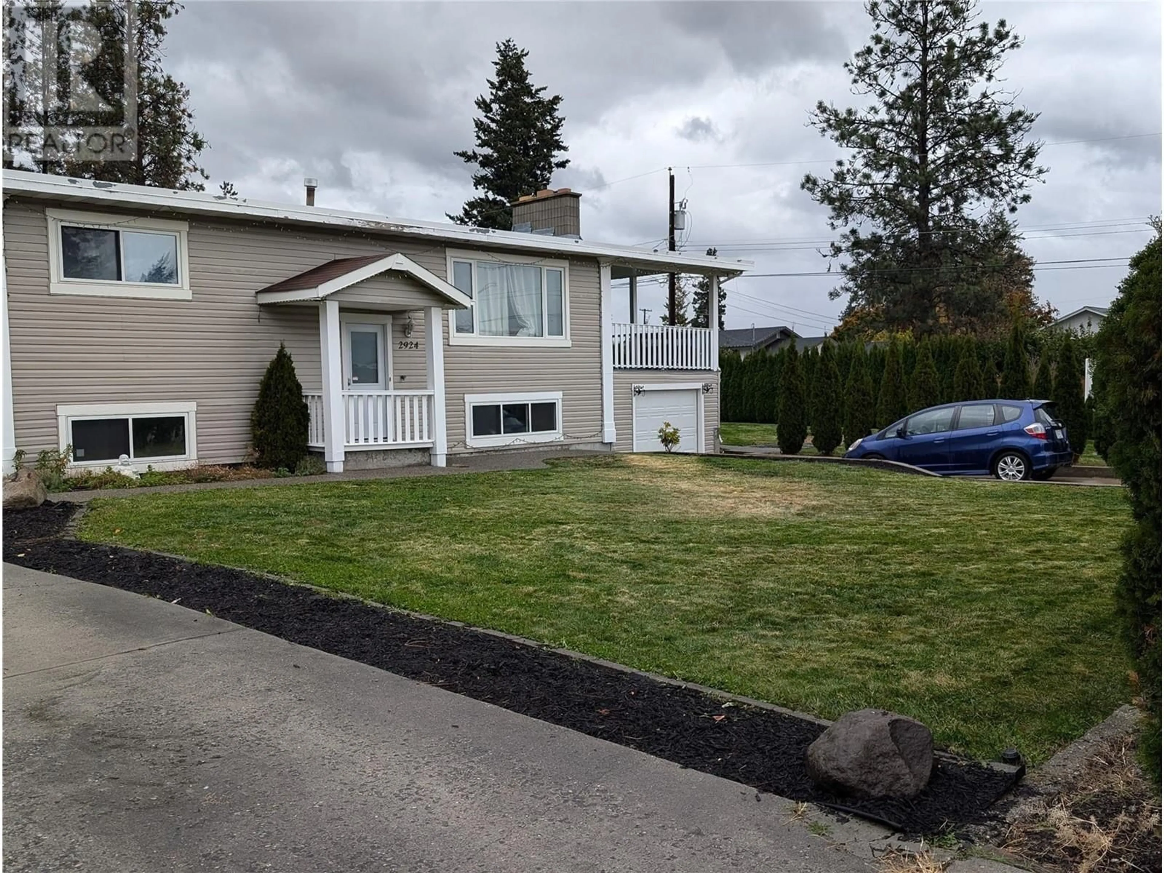 Frontside or backside of a home, the fenced backyard for 2924 Gorman Road, West Kelowna British Columbia V4T1H4