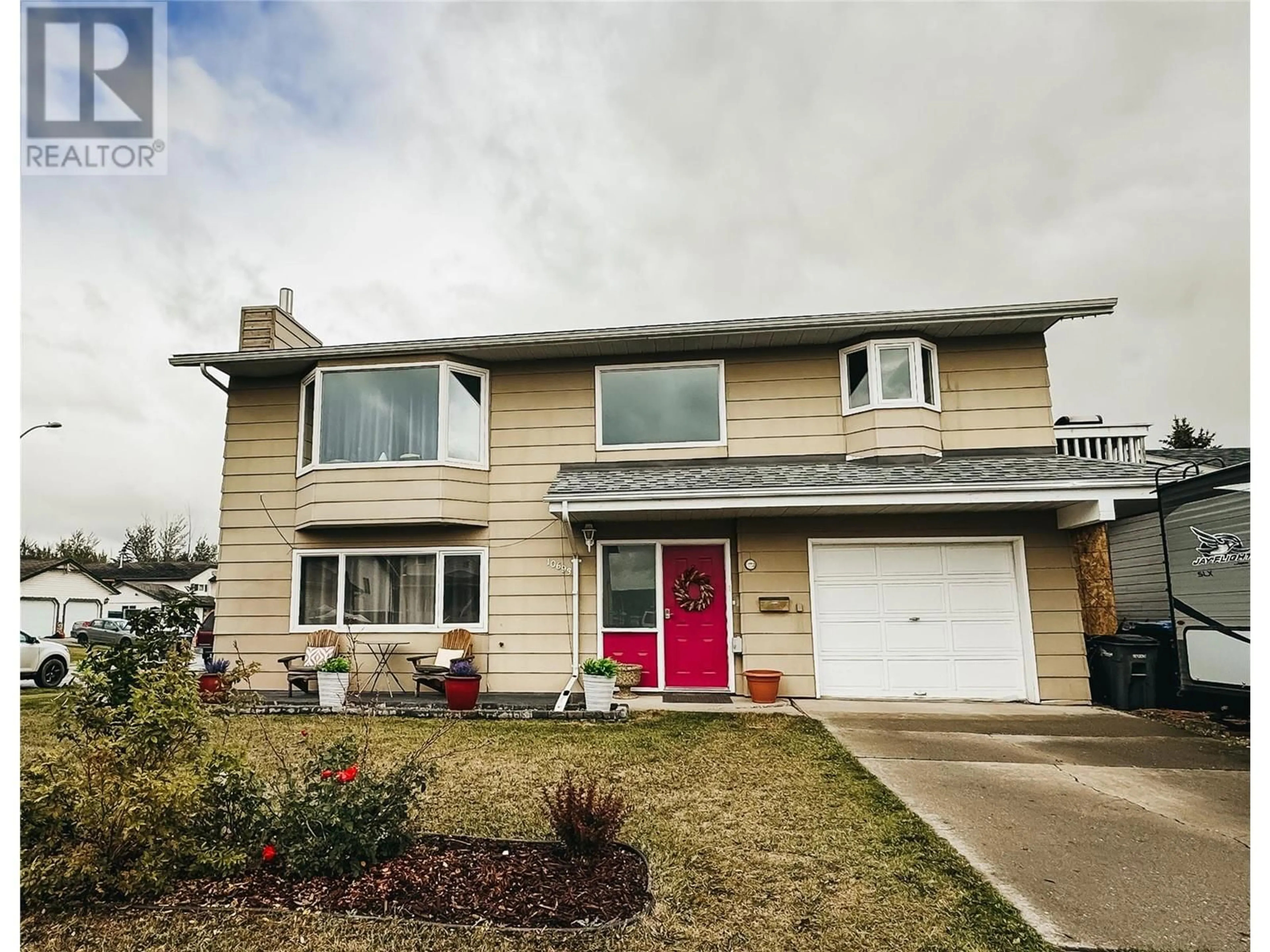 Frontside or backside of a home, the street view for 10693 Cottonwood Crescent, Dawson Creek British Columbia V1G4M3