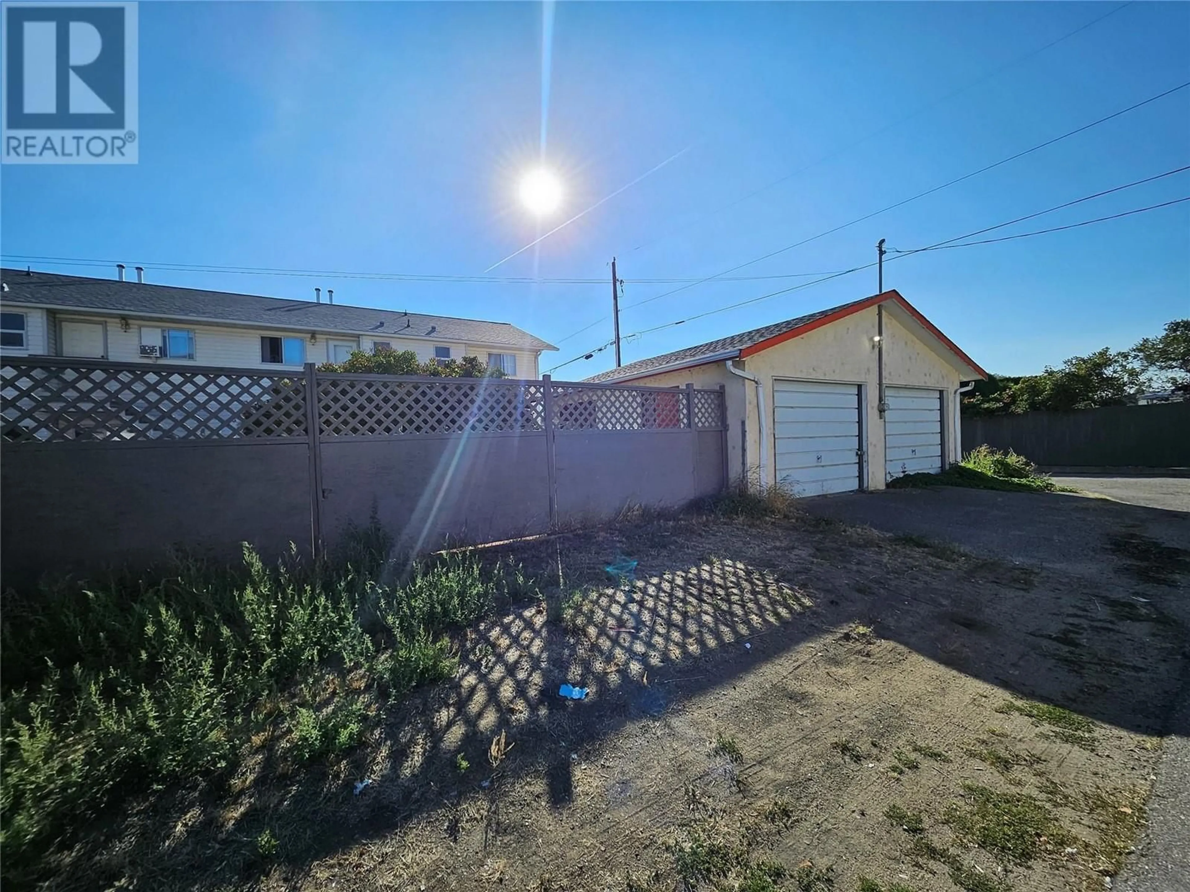 A pic from outside/outdoor area/front of a property/back of a property/a pic from drone, street for 1084 Dynes Avenue, Penticton British Columbia V2A1G1