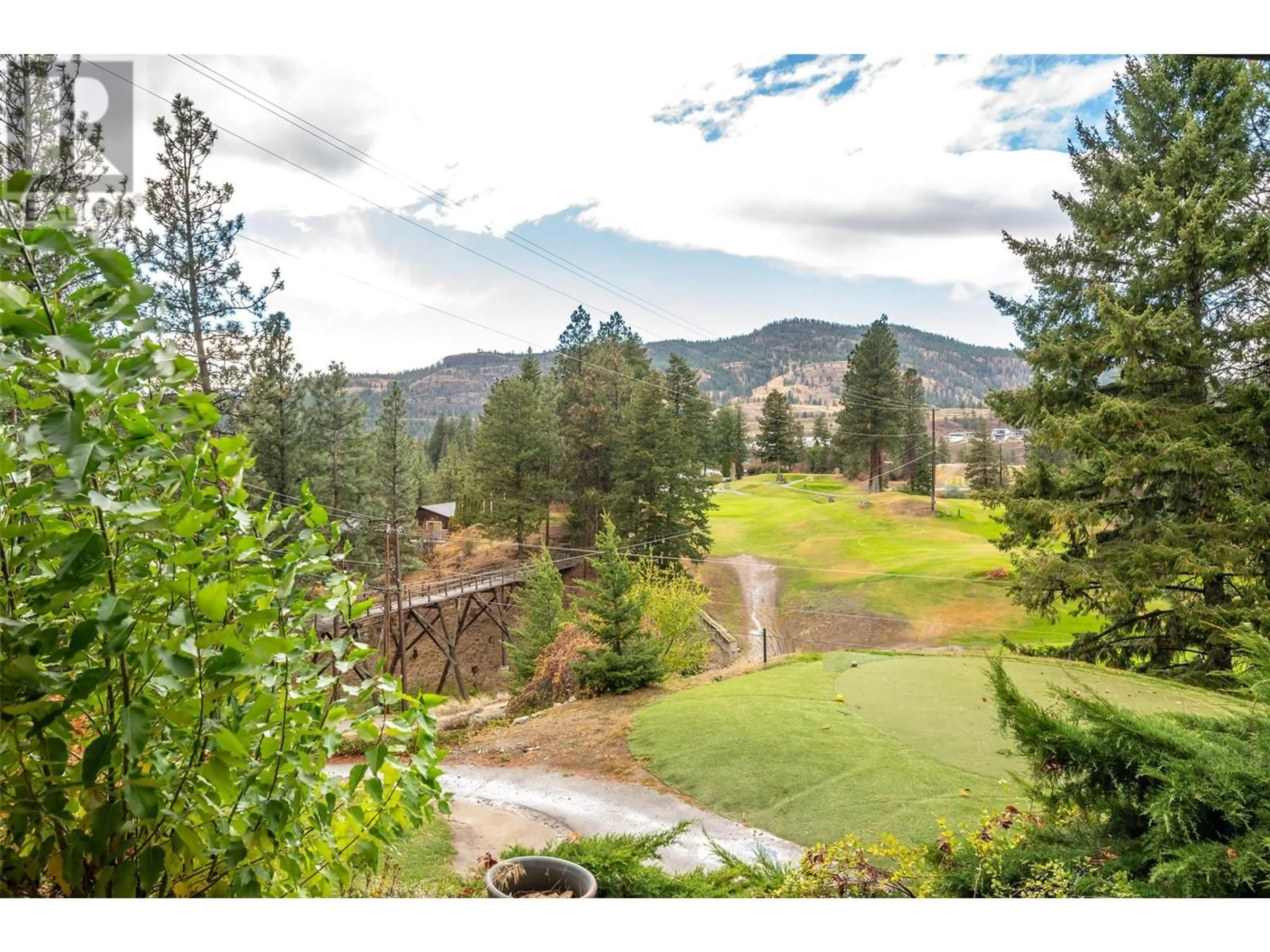 A pic from exterior of the house or condo, the fenced backyard for 144 SUMAC RIDGE Drive Unit# 11, Summerland British Columbia V0H1Z6