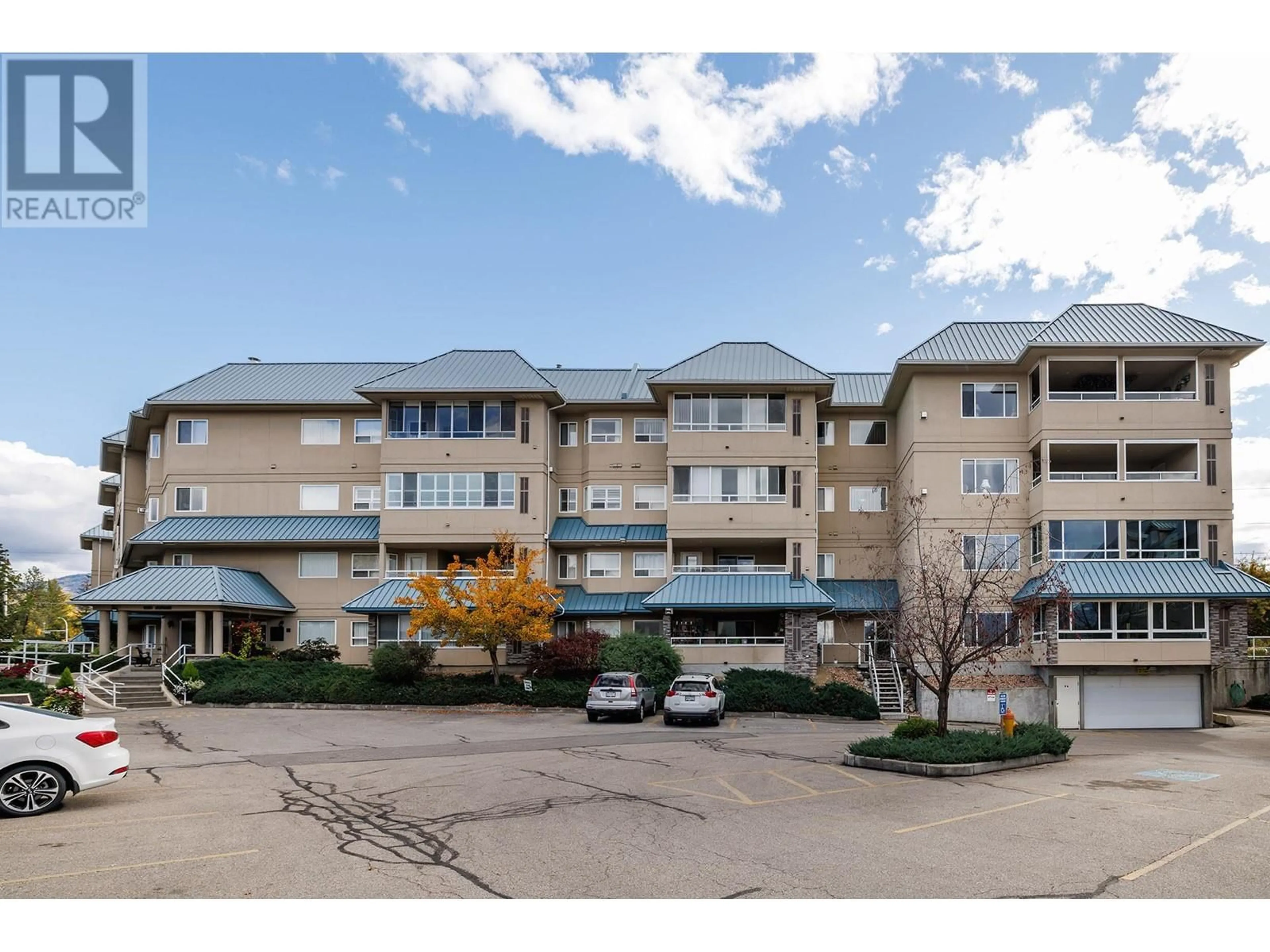 A pic from exterior of the house or condo, the front or back of building for 1961 Durnin Road Unit# 210, Kelowna British Columbia V1X7Y4