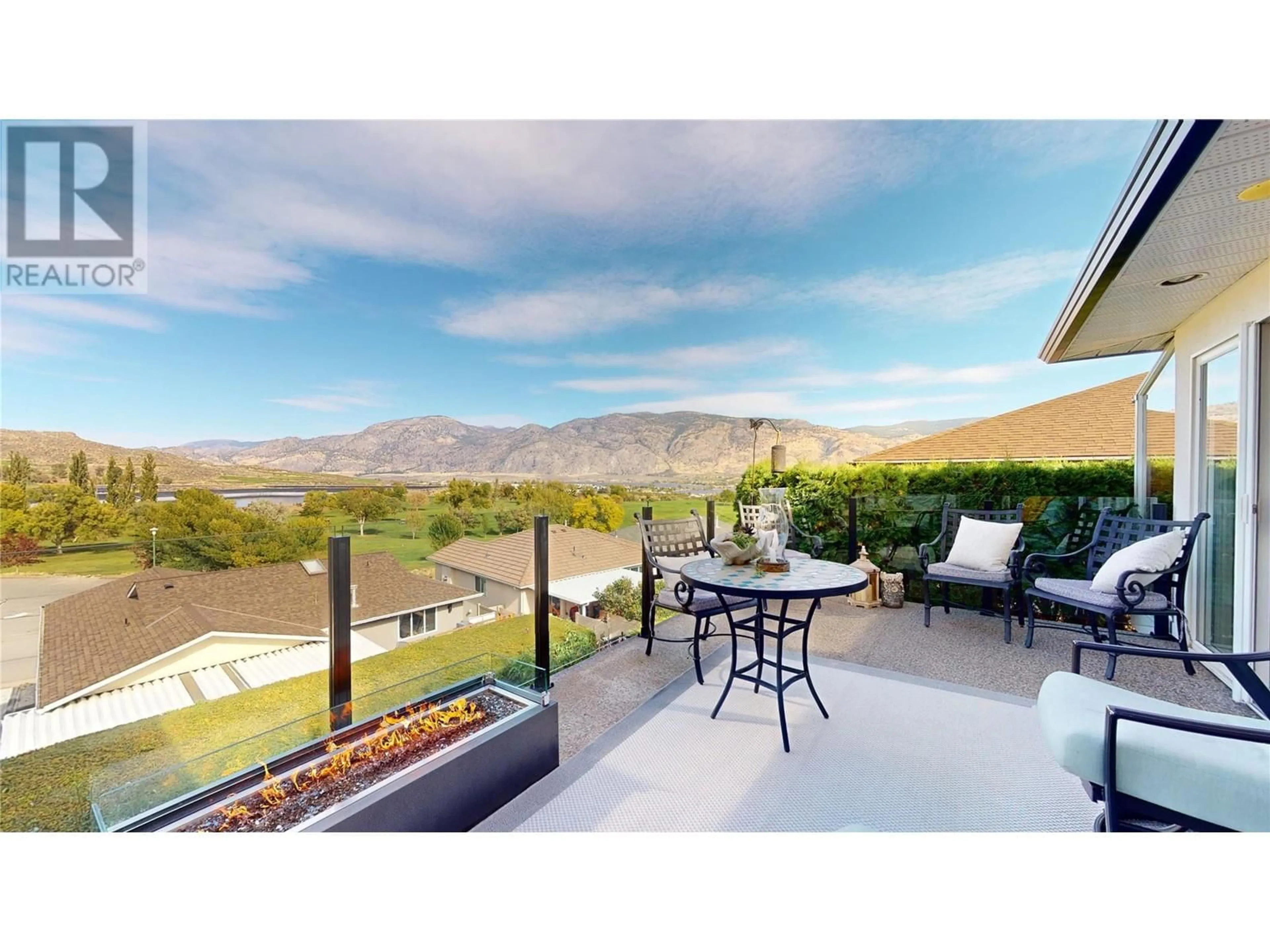 Patio, the fenced backyard for 11905 Quail Ridge Place, Osoyoos British Columbia V0H1V4