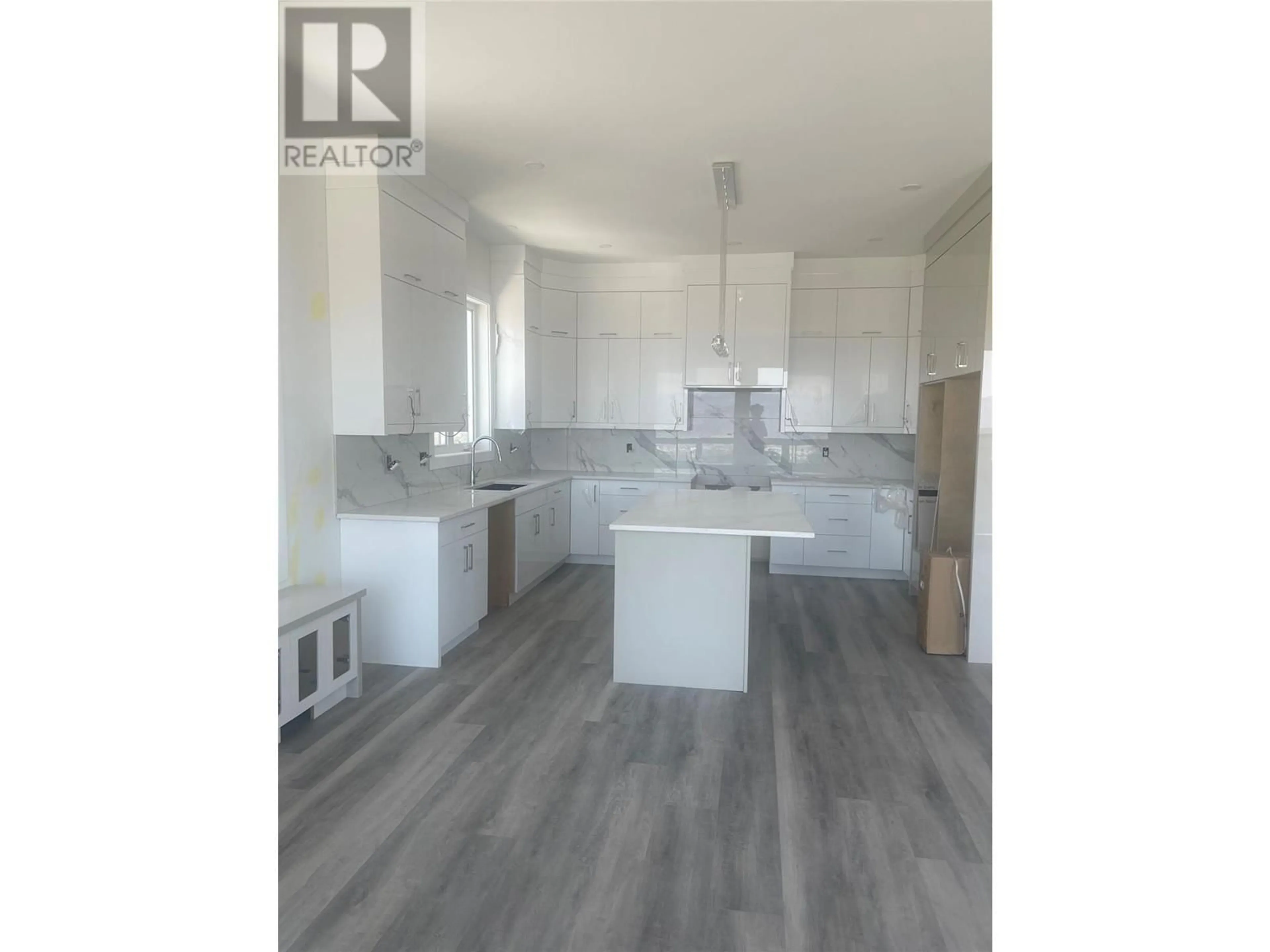 Open concept kitchen, wood/laminate floor for 2231 LAVETTA DRIVE, Kelowna British Columbia V1P1R3
