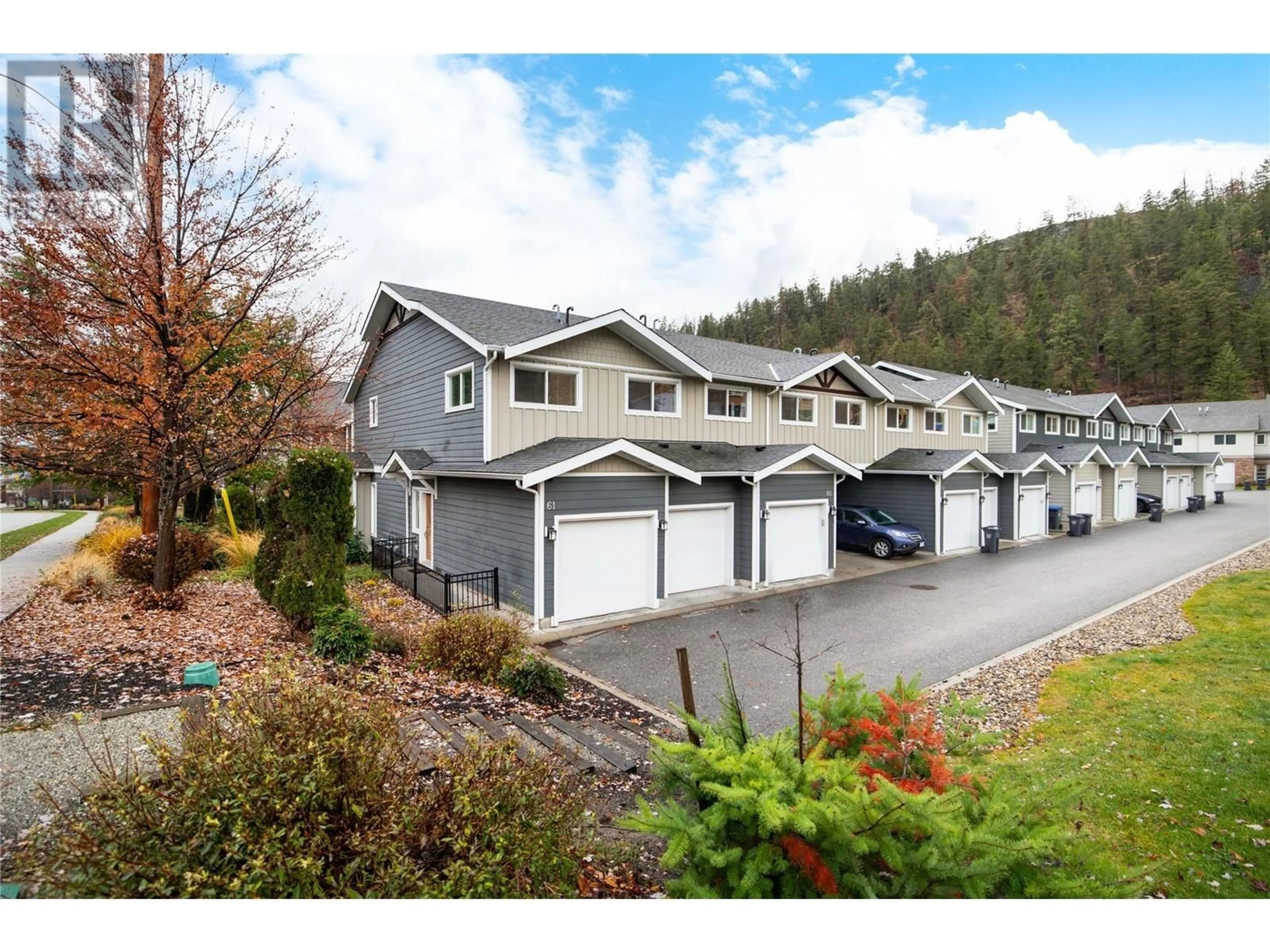 A pic from exterior of the house or condo, the fenced backyard for 600 Boynton Place Unit# 61, Kelowna British Columbia V1V2B8