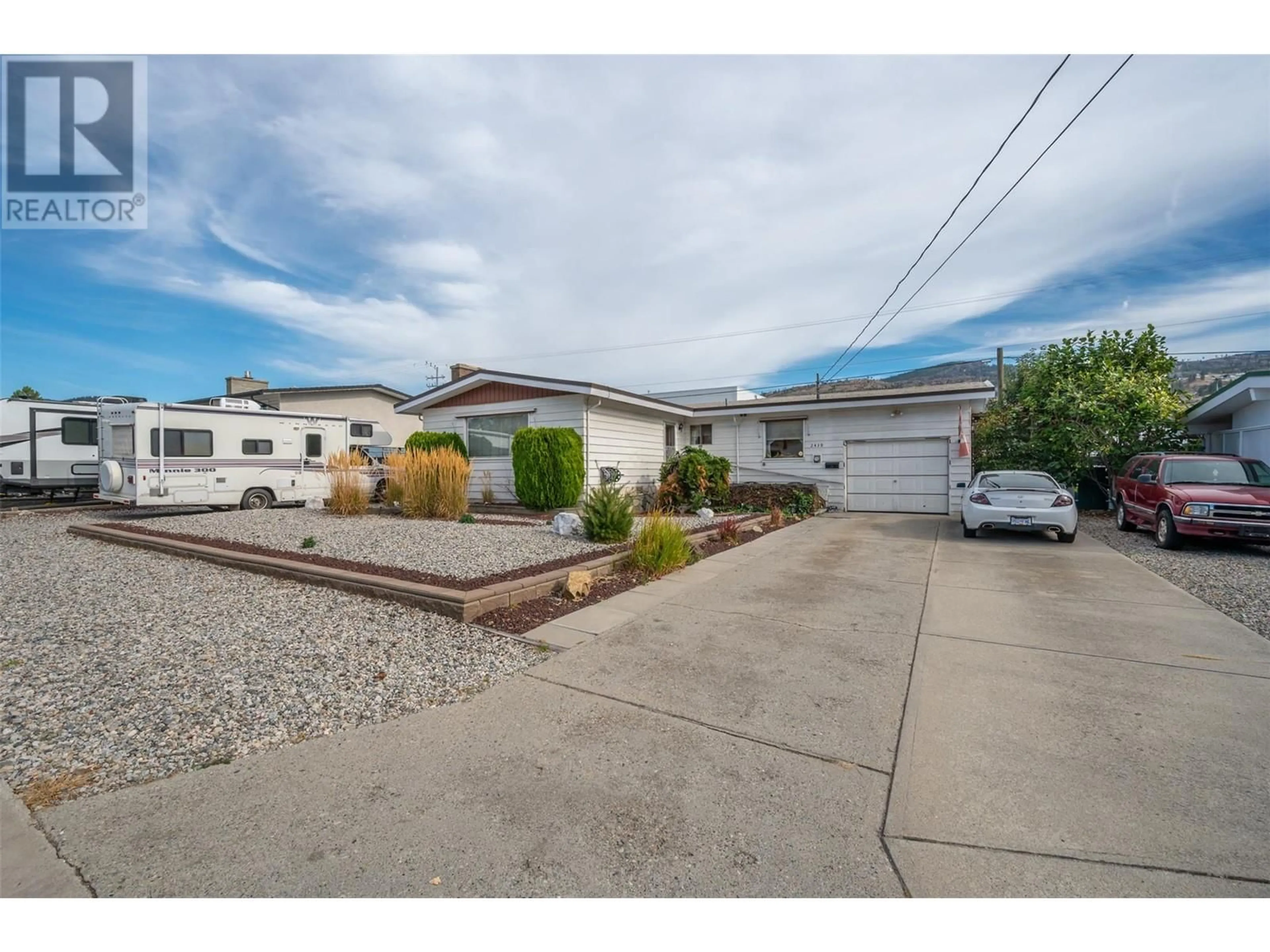 Frontside or backside of a home, the street view for 2430 McKenzie Street, Penticton British Columbia V2A6H7