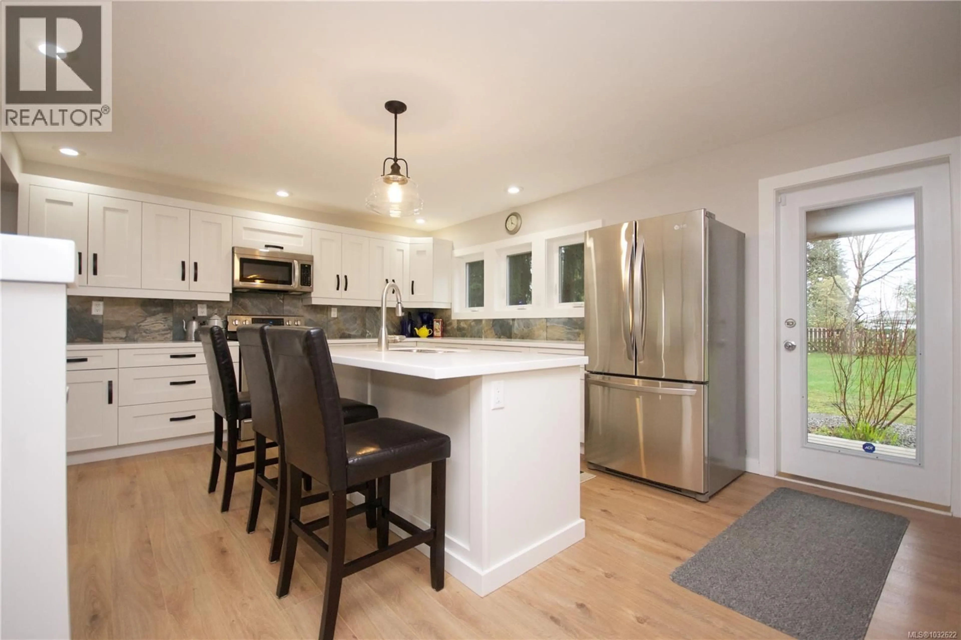 Open concept kitchen, wood/laminate floor for 1221 GANSKE ROAD, Qualicum Beach British Columbia V9K2G4