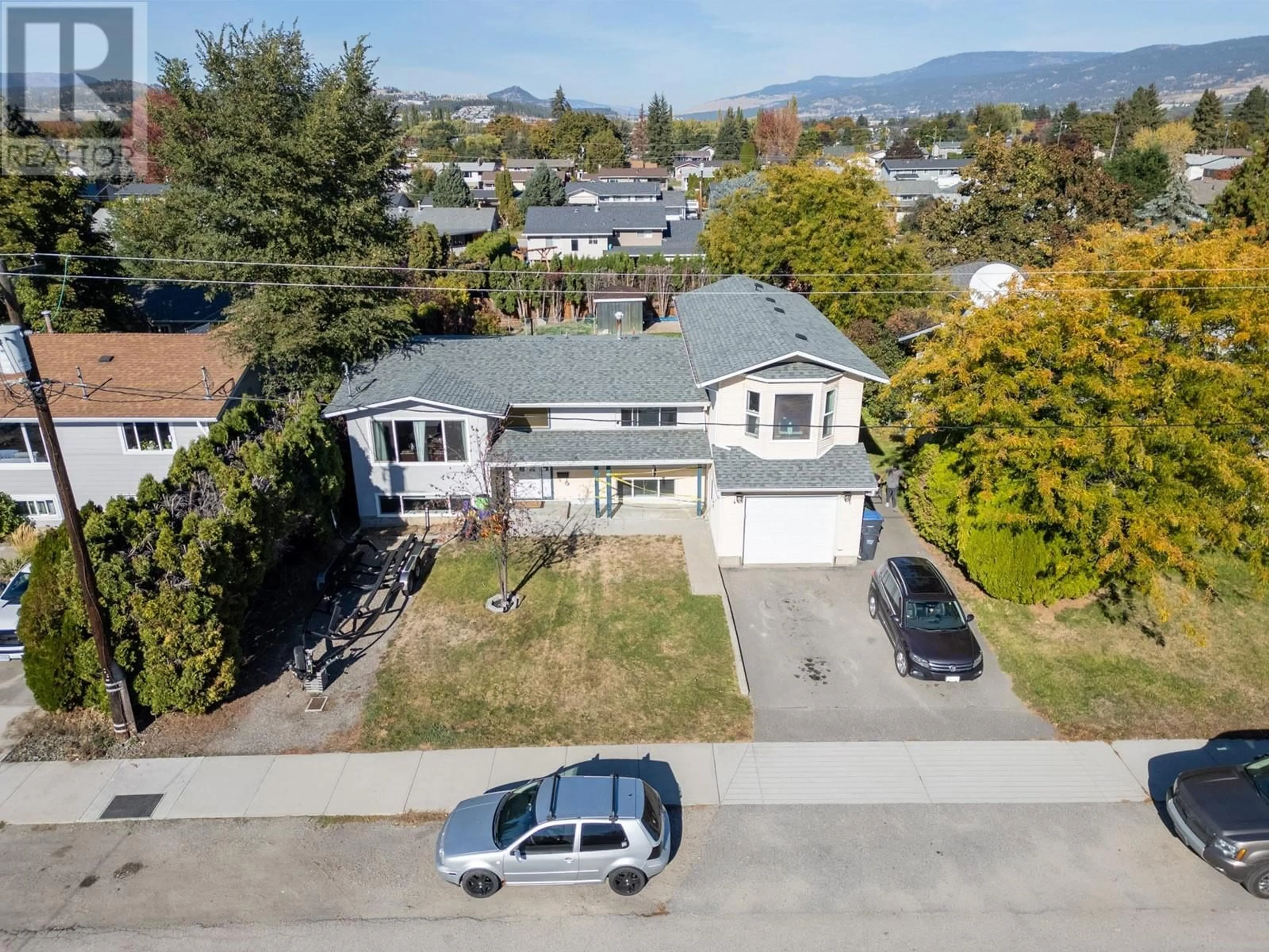 Frontside or backside of a home, the street view for 310 Pearson Road, Kelowna British Columbia V1X2L6