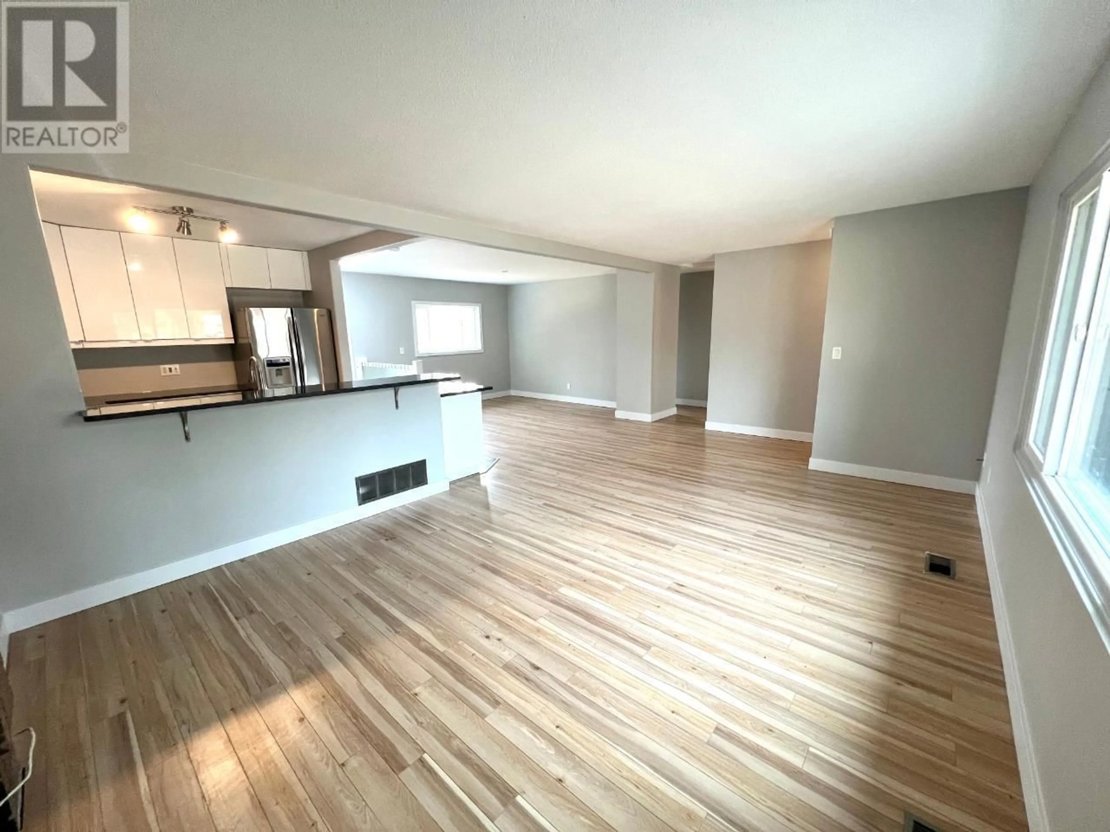 A pic of a room, wood floors for 100 Glenview Crescent, Princeton British Columbia V0X1W0