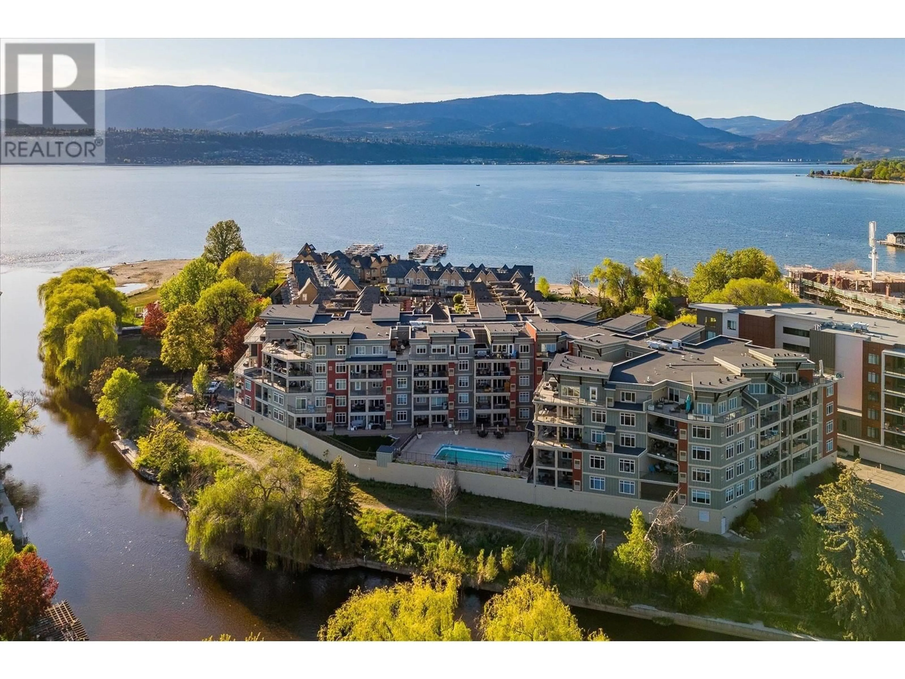 A pic from outside/outdoor area/front of a property/back of a property/a pic from drone, water/lake/river/ocean view for 204 - 3865 TRUSWELL ROAD, Kelowna British Columbia V1W3K9