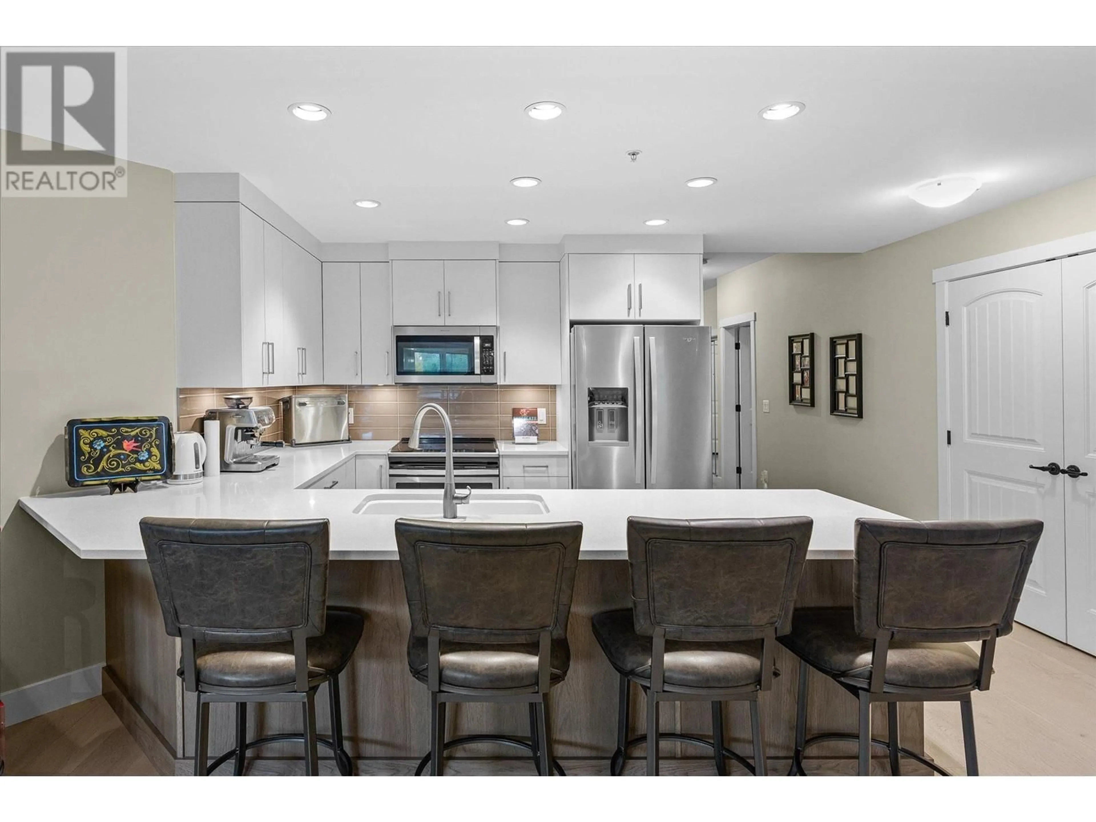 Open concept kitchen, ceramic/tile floor for 204 - 3865 TRUSWELL ROAD, Kelowna British Columbia V1W3K9