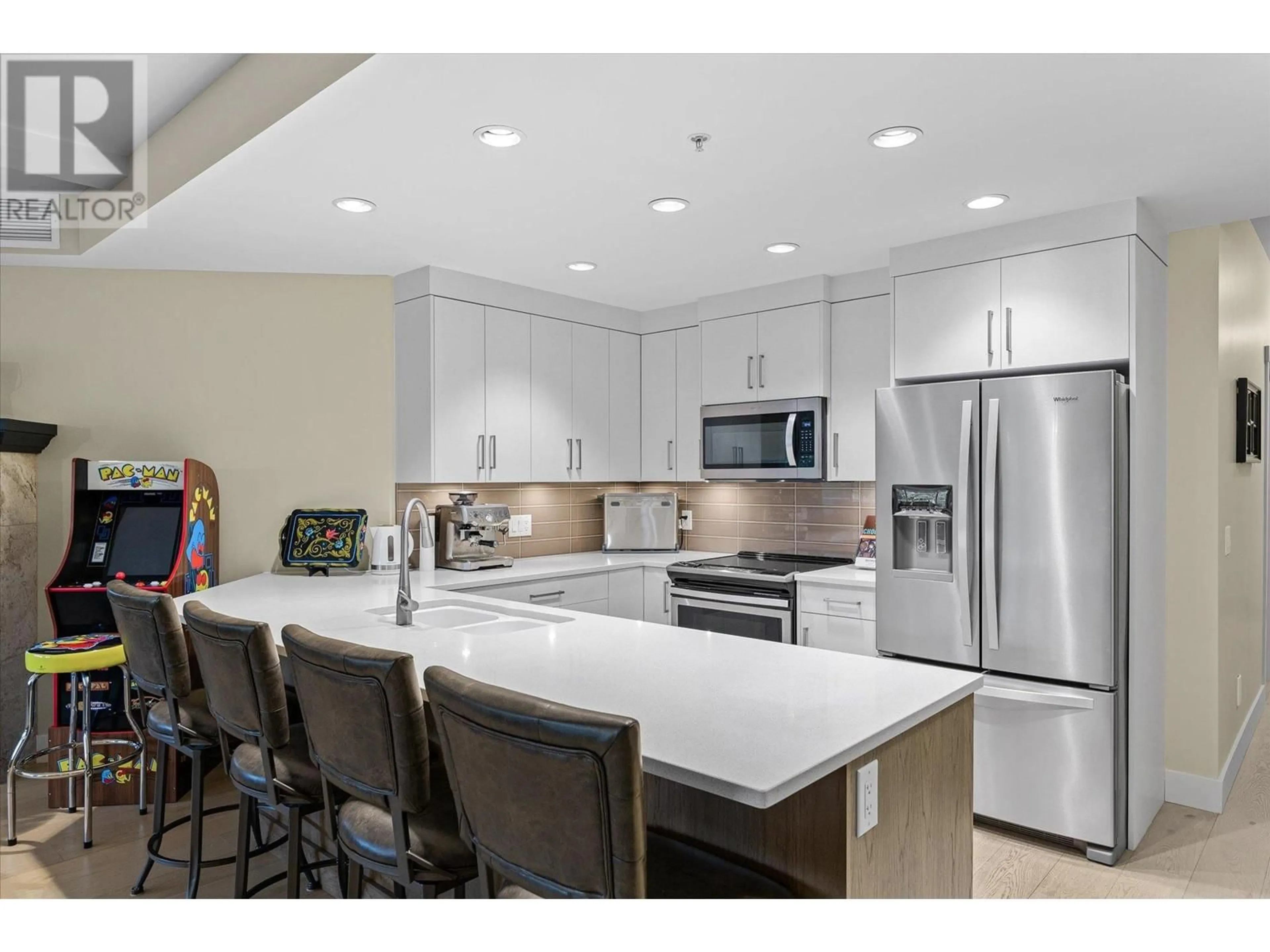 Open concept kitchen, ceramic/tile floor for 204 - 3865 TRUSWELL ROAD, Kelowna British Columbia V1W3K9