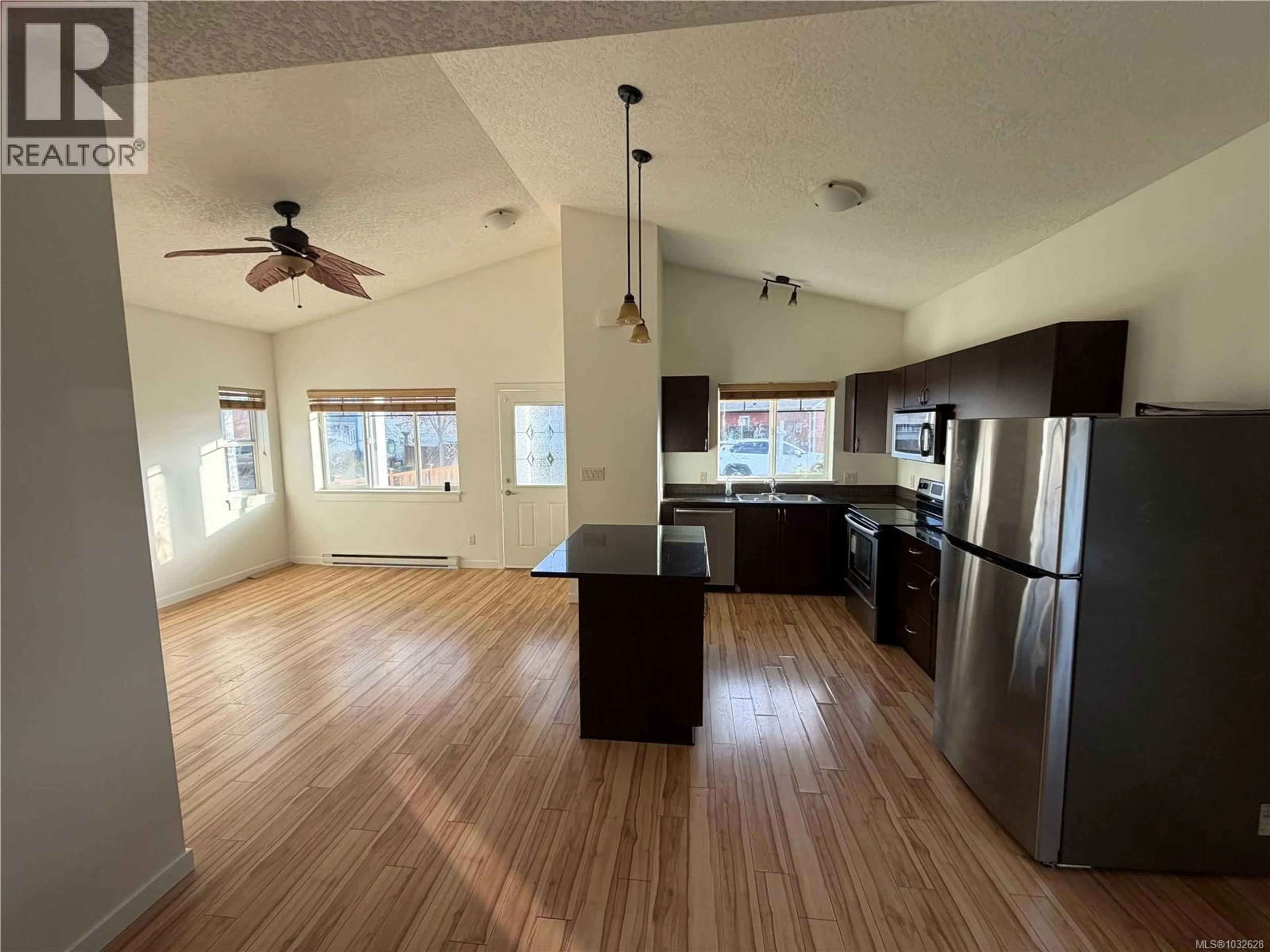 Open concept kitchen, wood/laminate floor for 2918 GOLDEN SPIKE PLACE, Langford British Columbia V9B0B2