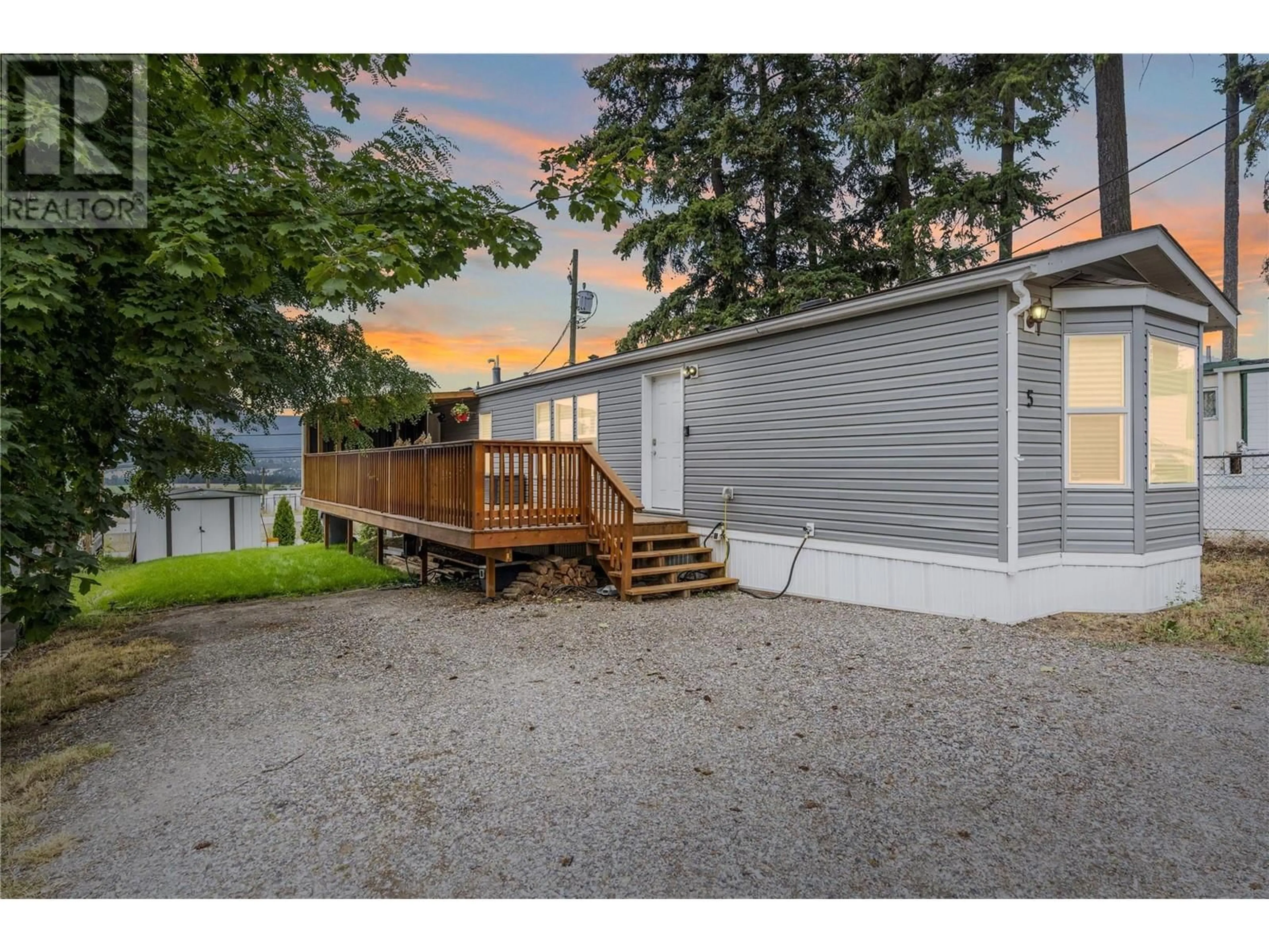 A pic from exterior of the house or condo, the fenced backyard for 934 Hutley Road Unit# 5, Armstrong British Columbia V4Y0R5