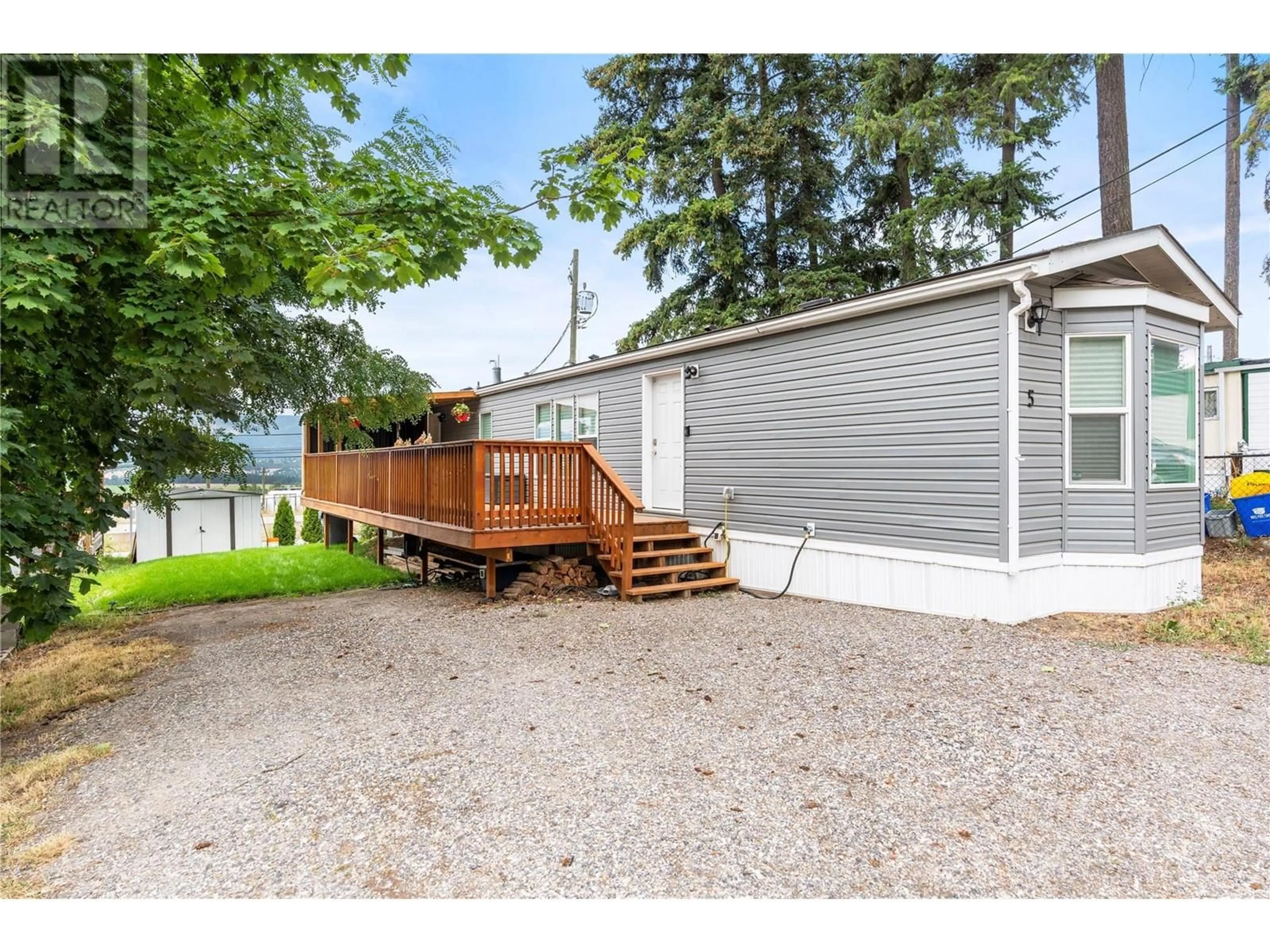 A pic from exterior of the house or condo, the fenced backyard for 934 Hutley Road Unit# 5, Armstrong British Columbia V4Y0R5