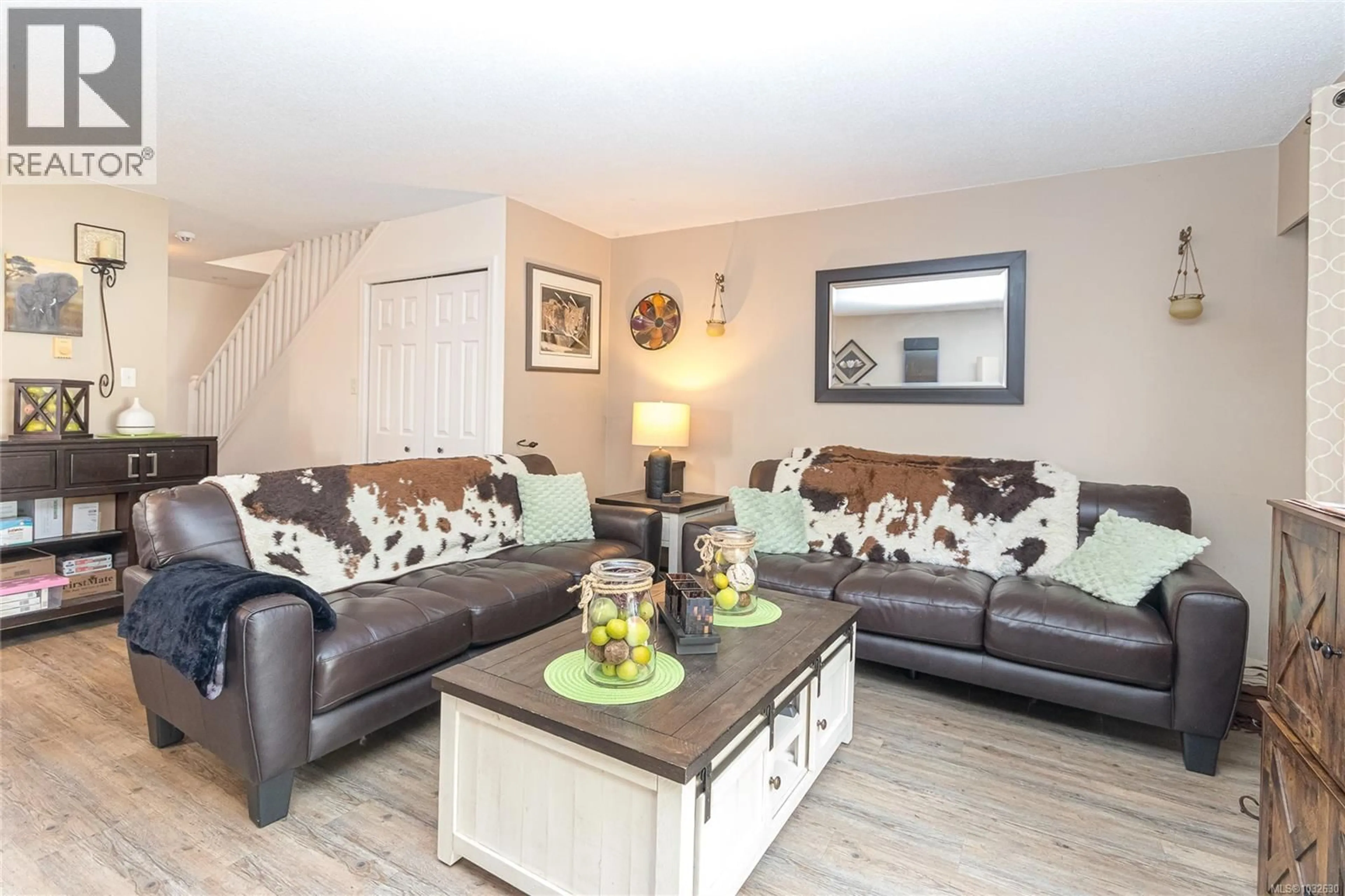 Living room with furniture, wood/laminate floor for 2834 SOOKE ROAD, Langford British Columbia V9B4J9