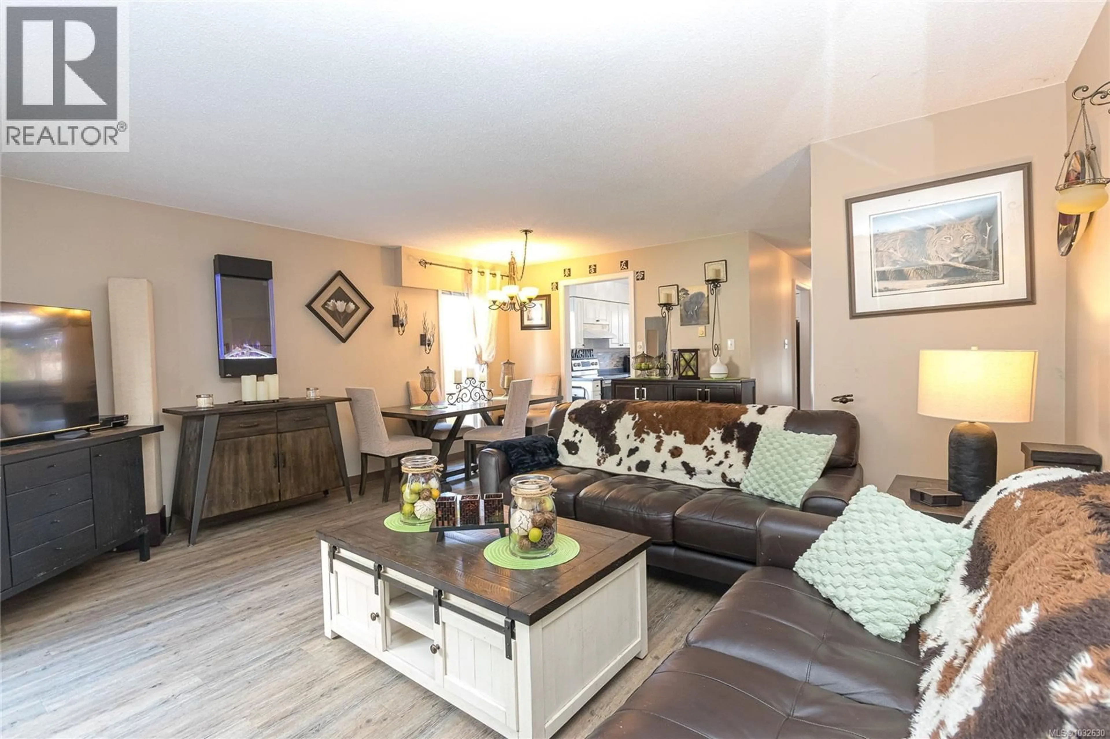 Living room with furniture, wood/laminate floor for 2834 SOOKE ROAD, Langford British Columbia V9B4J9