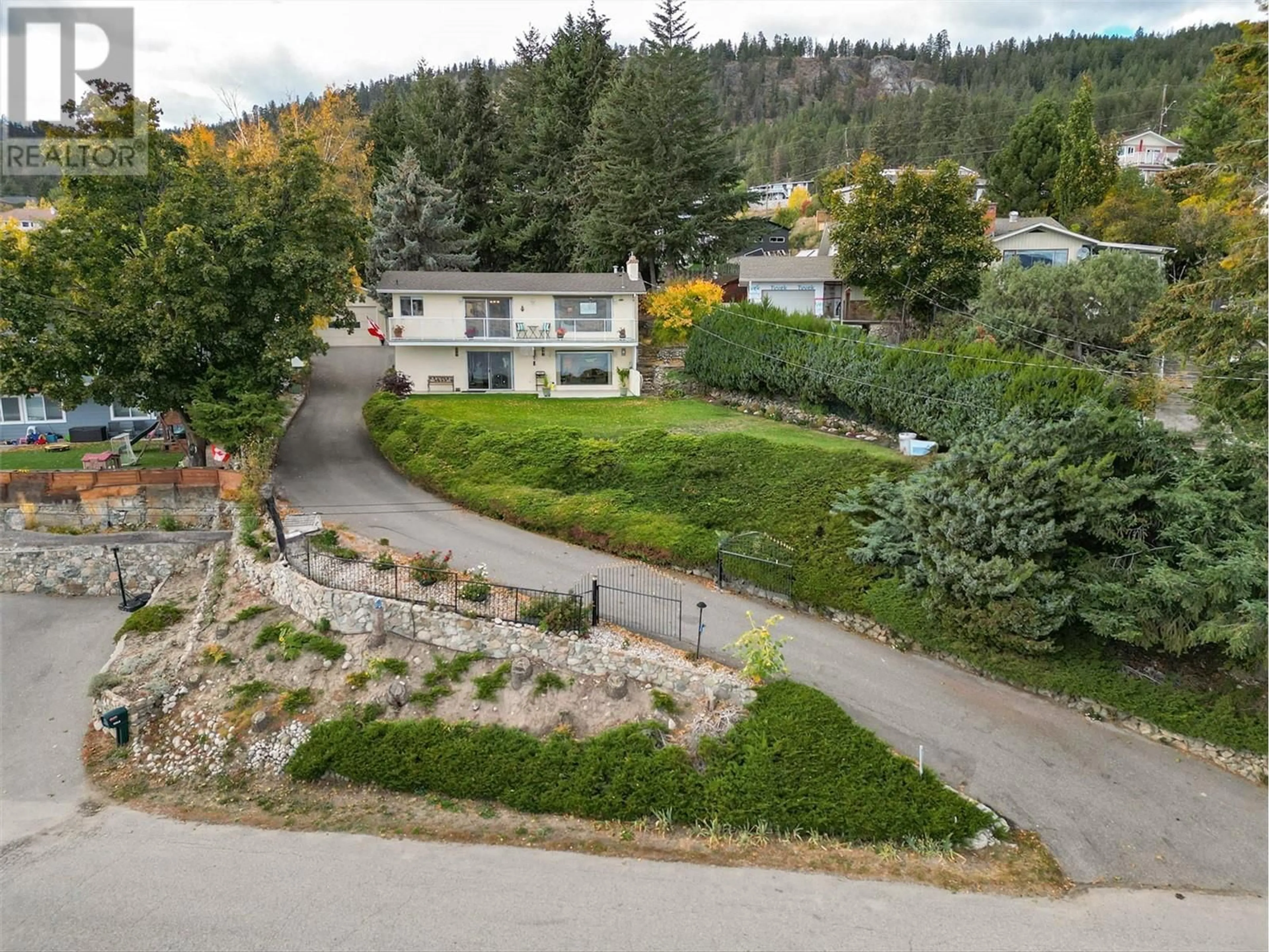 Frontside or backside of a home, the street view for 6050 Beatrice Road, Peachland British Columbia V0H1X4