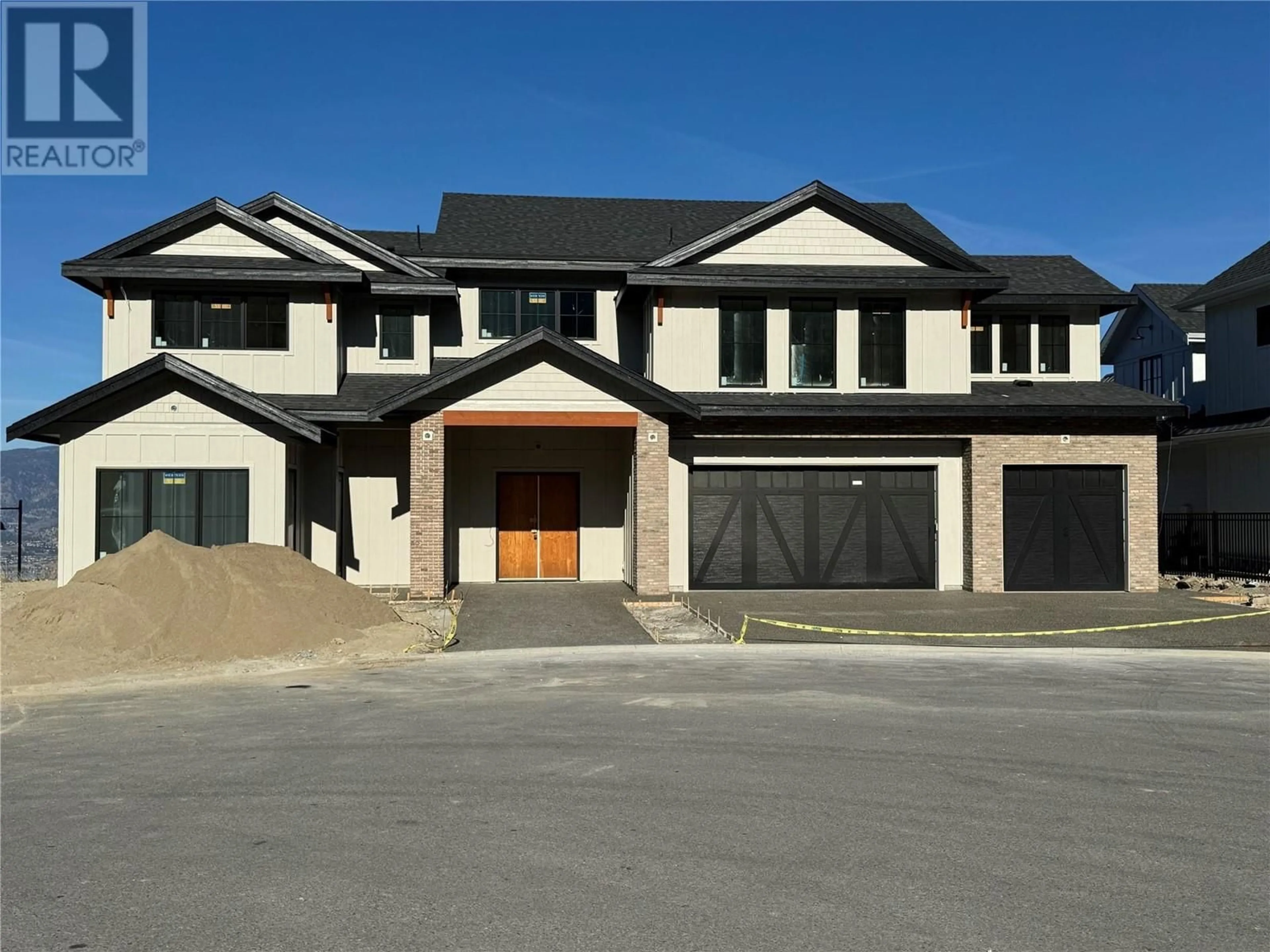 Frontside or backside of a home, the street view for 5631 Upper Mission Court, Kelowna British Columbia V1W0C5