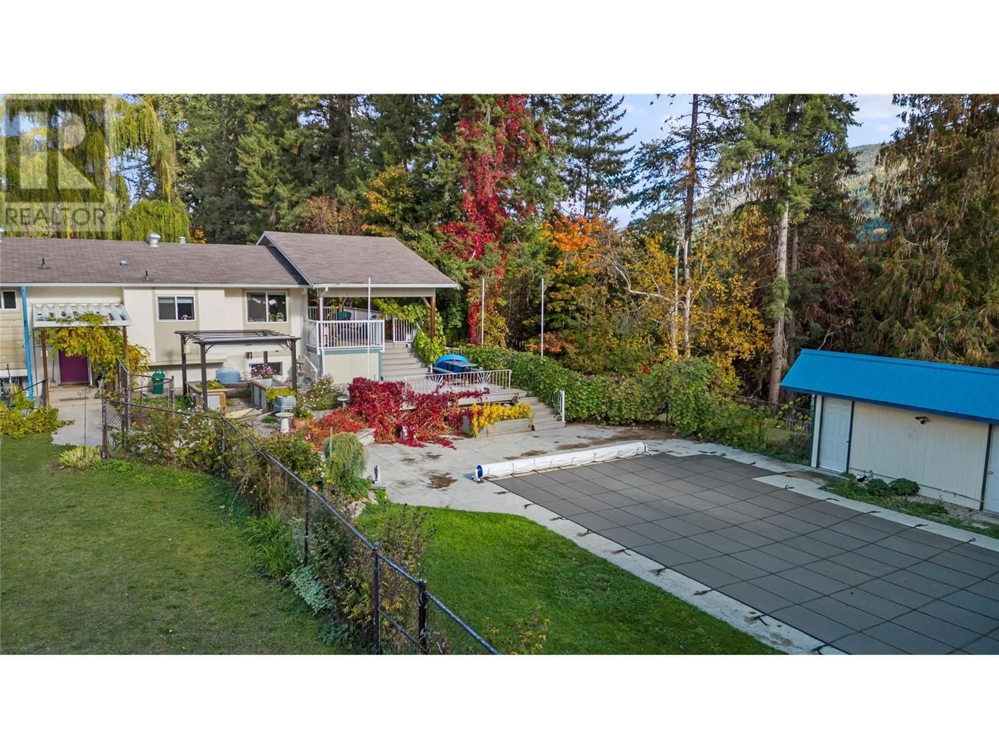 Frontside or backside of a home, the fenced backyard for 3360 40th Street NE, Salmon Arm British Columbia V1E1Z6