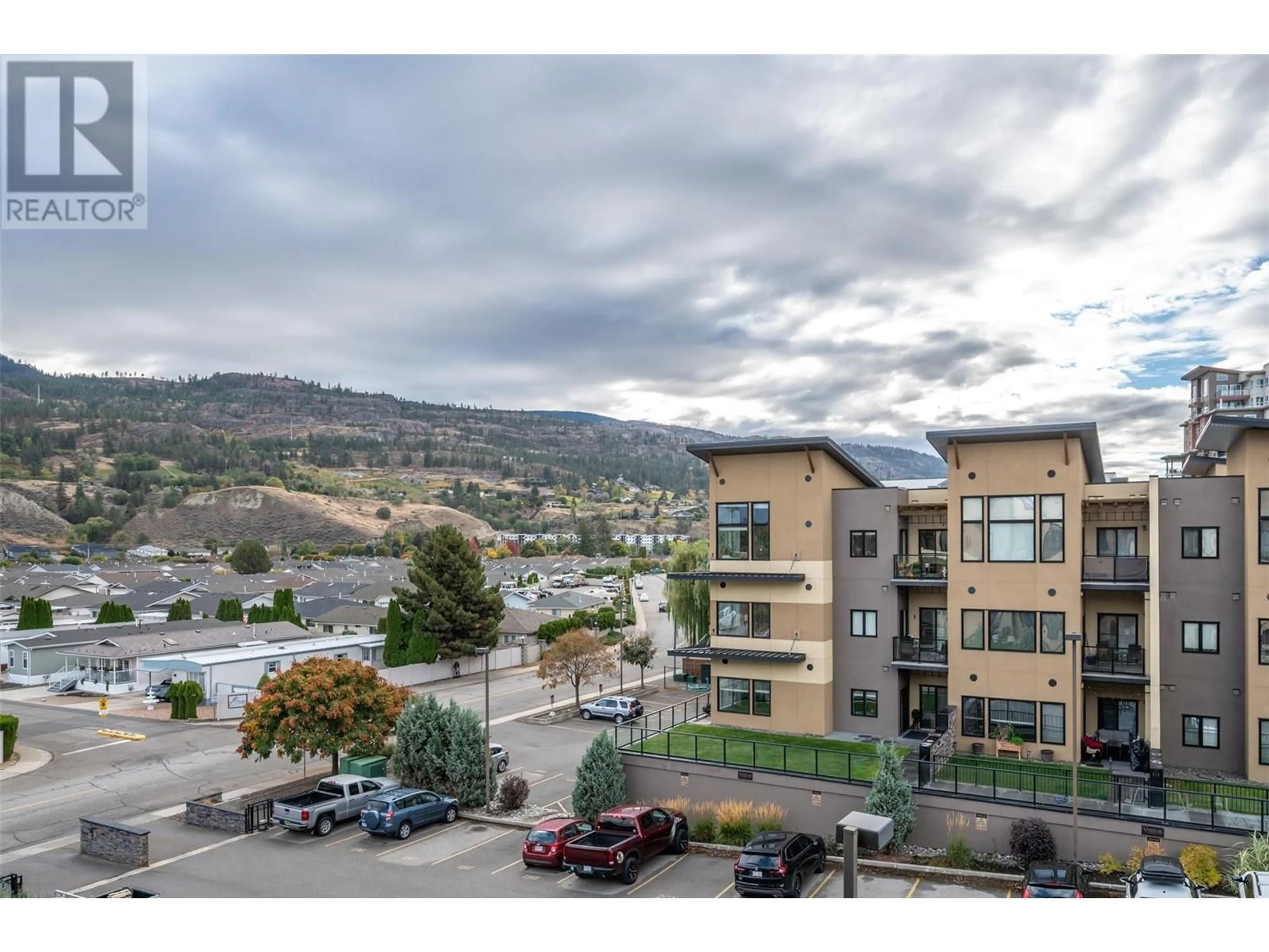 A pic from outside/outdoor area/front of a property/back of a property/a pic from drone, mountain view for 410 - 3311 WILSON STREET, Penticton British Columbia V2A8J3