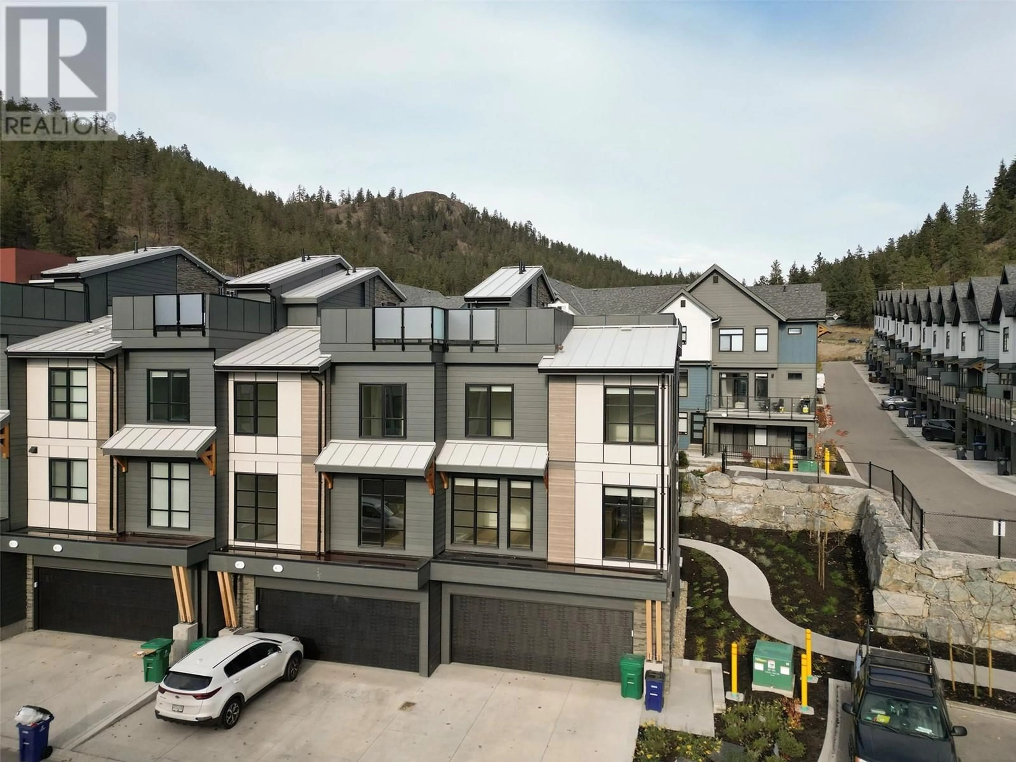 A pic from exterior of the house or condo, the street view for 1455 Cara Glen Court Court Unit# 104, Kelowna British Columbia V1V2J1