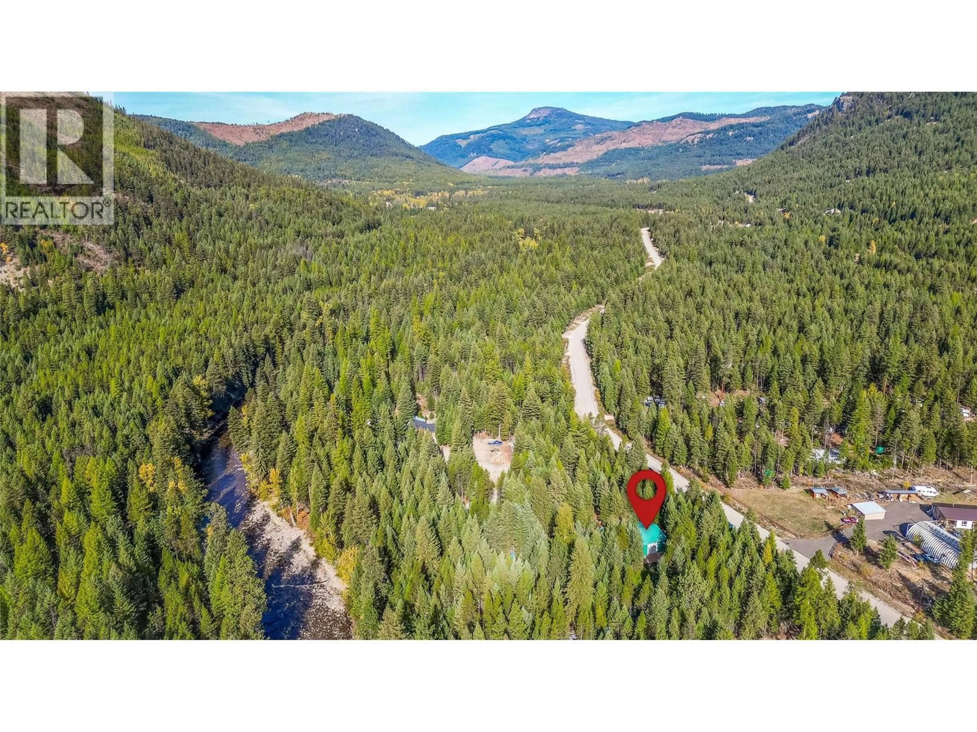 A pic from outside/outdoor area/front of a property/back of a property/a pic from drone, forest/trees view for 60 PRINGLE ROAD, Carmi British Columbia V0H1A0
