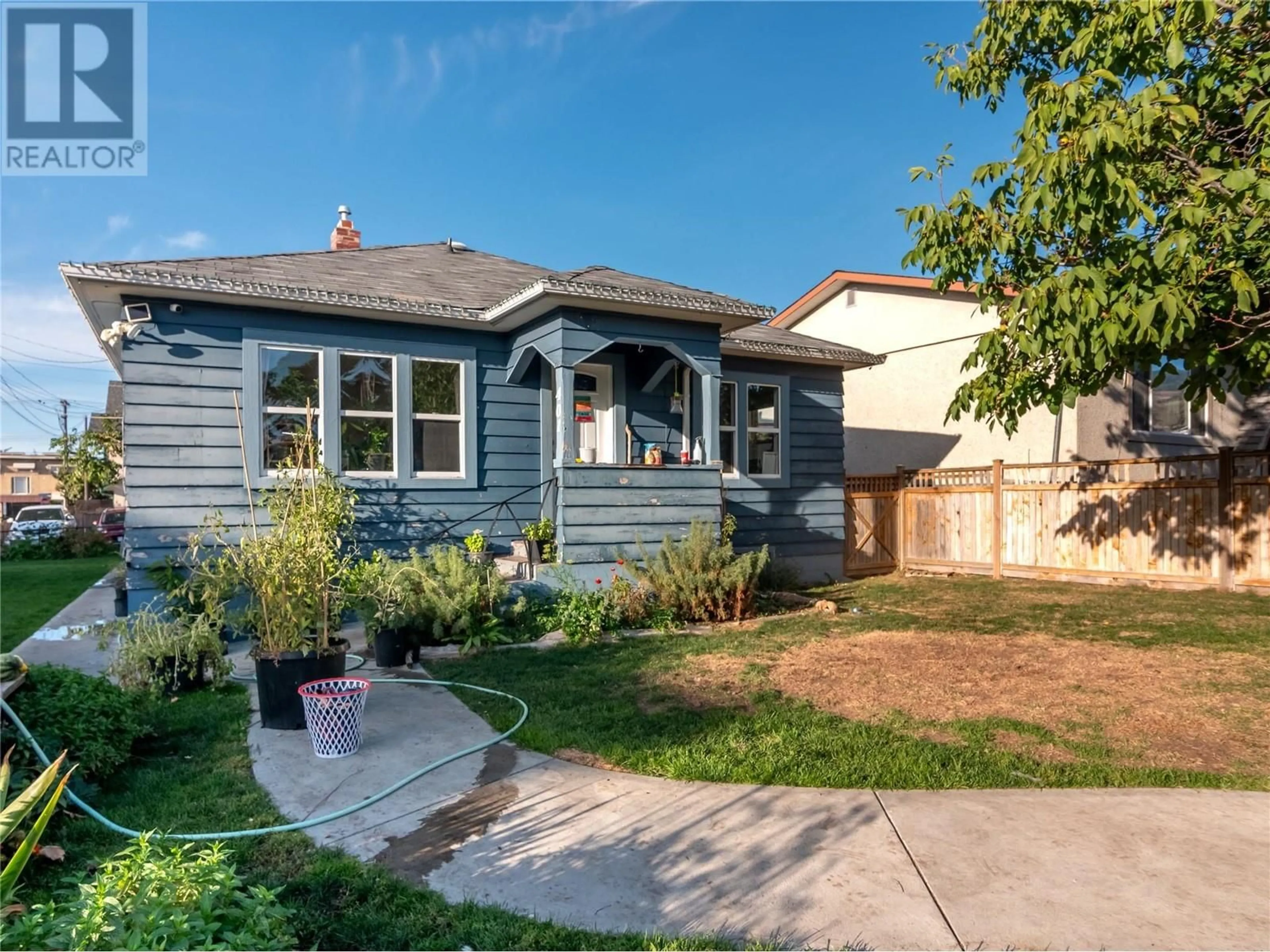 Frontside or backside of a home, the fenced backyard for 401 Gahan Avenue, Penticton British Columbia V2A2C6