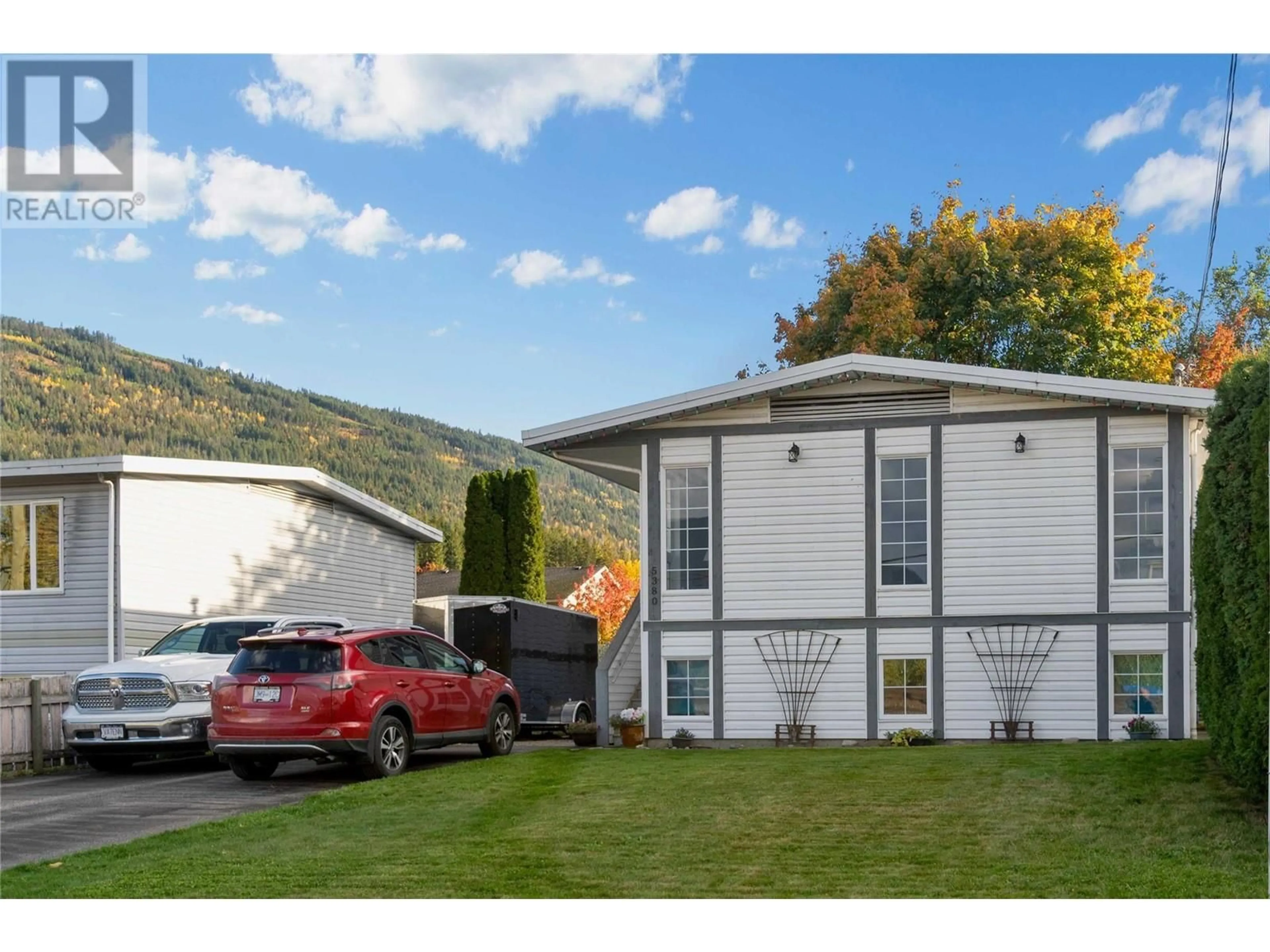 Frontside or backside of a home, the front or back of building for 5380 Canoe Beach Drive NE, Salmon Arm British Columbia V1E2M5