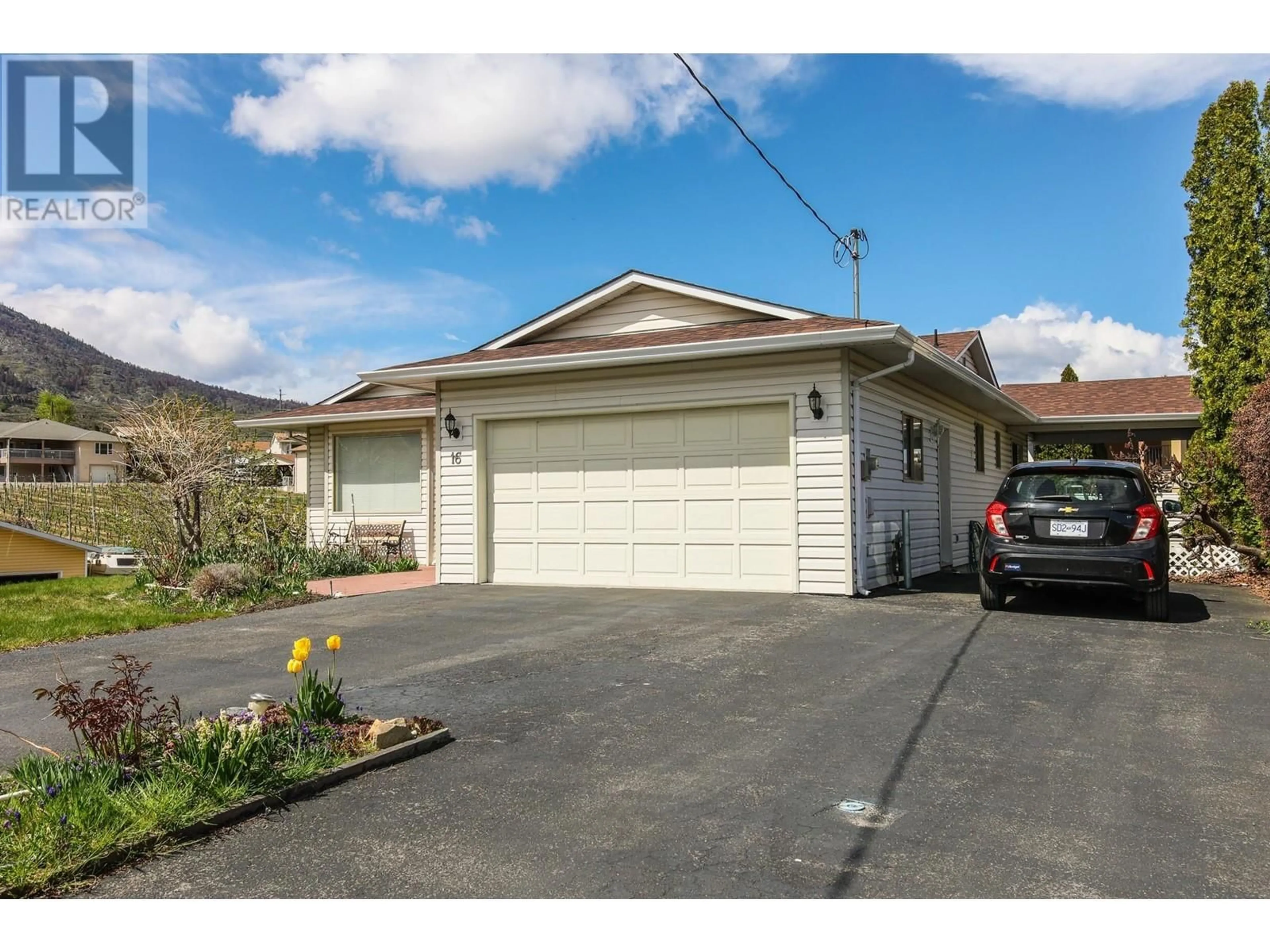 Frontside or backside of a home, the street view for 16 Yucca Place, Osoyoos British Columbia V0H1V1