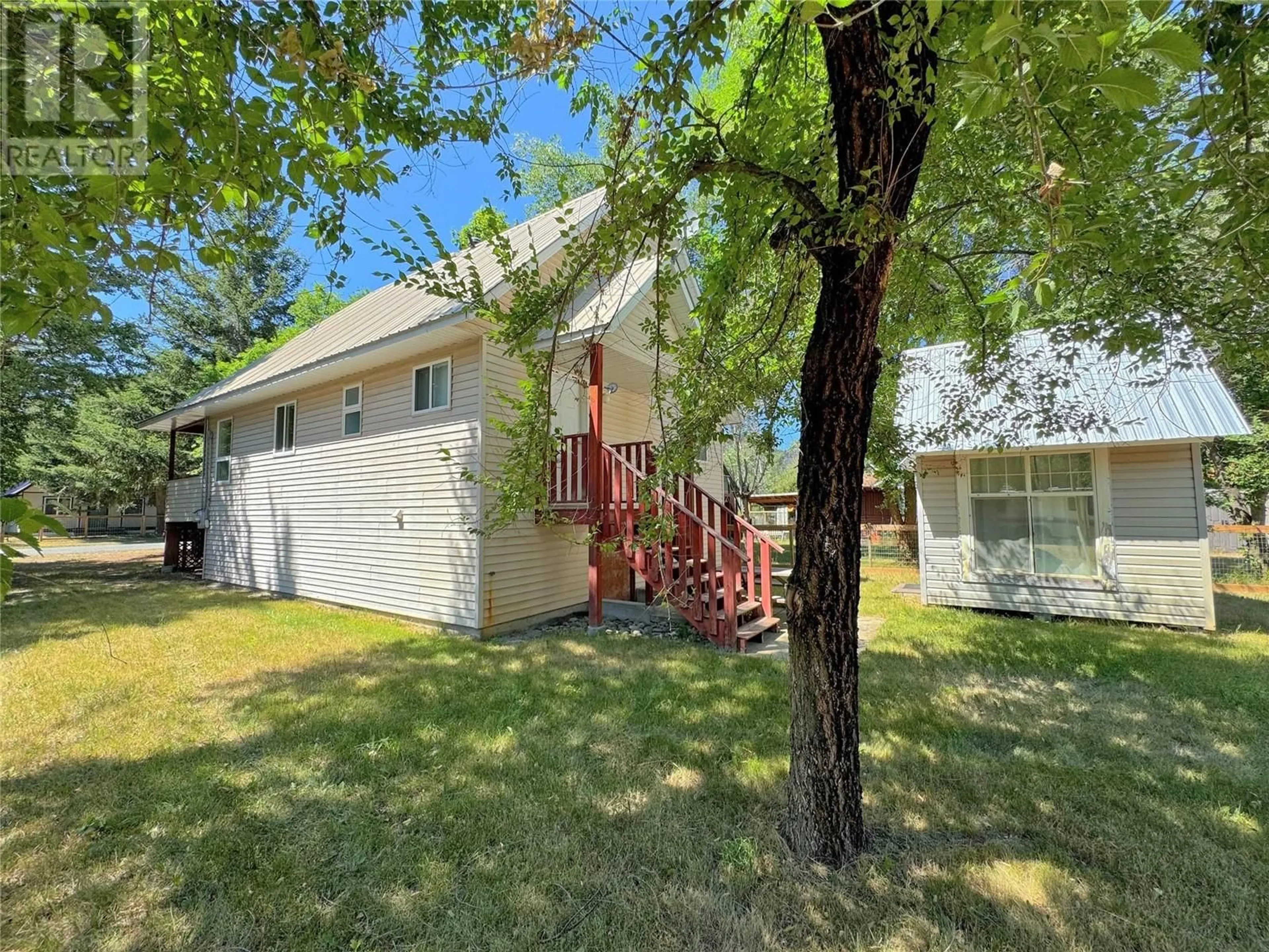 Frontside or backside of a home, the fenced backyard for 2647 STRATHCONA Avenue, Tulameen British Columbia V0W1W0