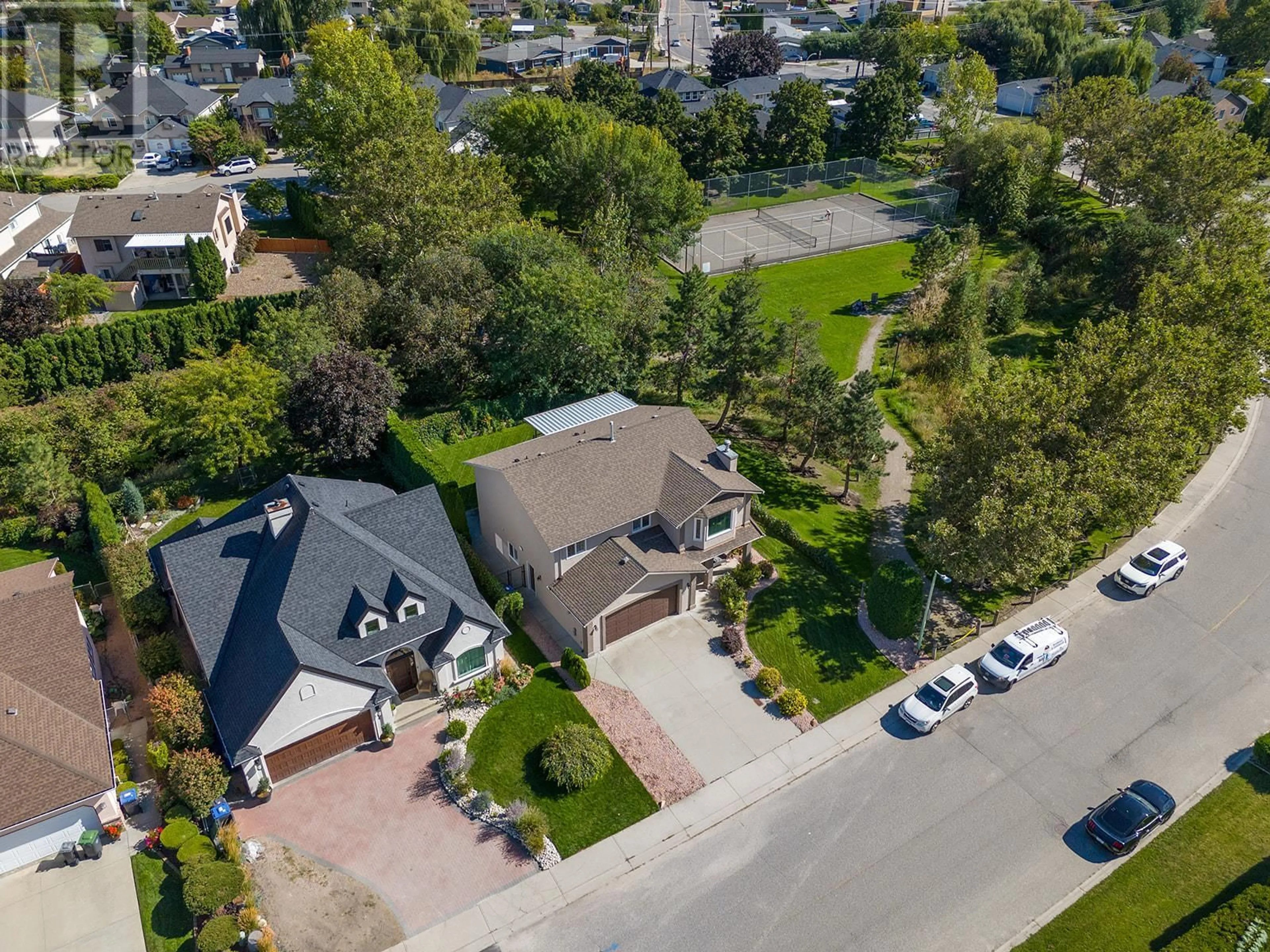 Frontside or backside of a home, the street view for 203 Biggar Road, Kelowna British Columbia V1V1W5