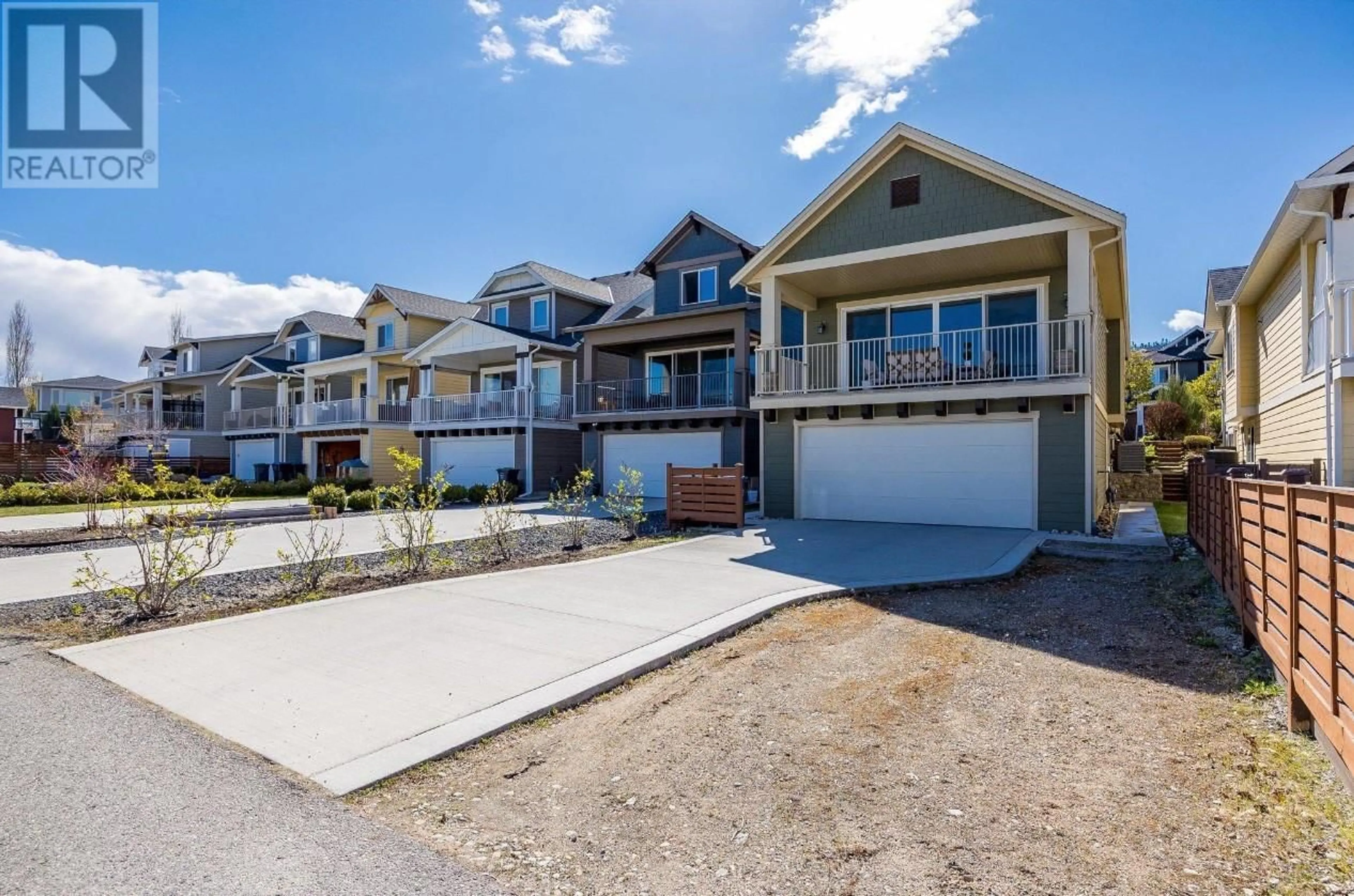 Frontside or backside of a home, the street view for 1274 Bergamot Avenue, Kelowna British Columbia V1W5K5