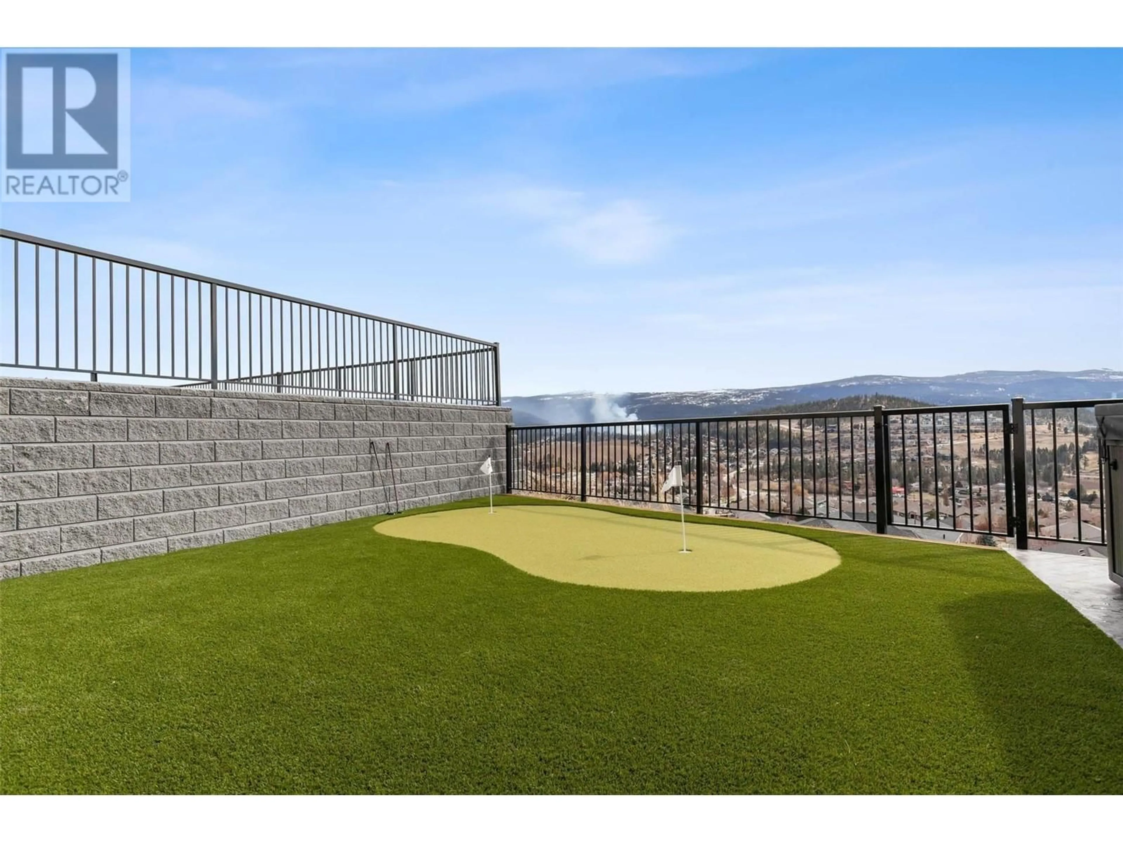 Patio, the fenced backyard for 1505 Fairwood Lane, Kelowna British Columbia V1P0A4