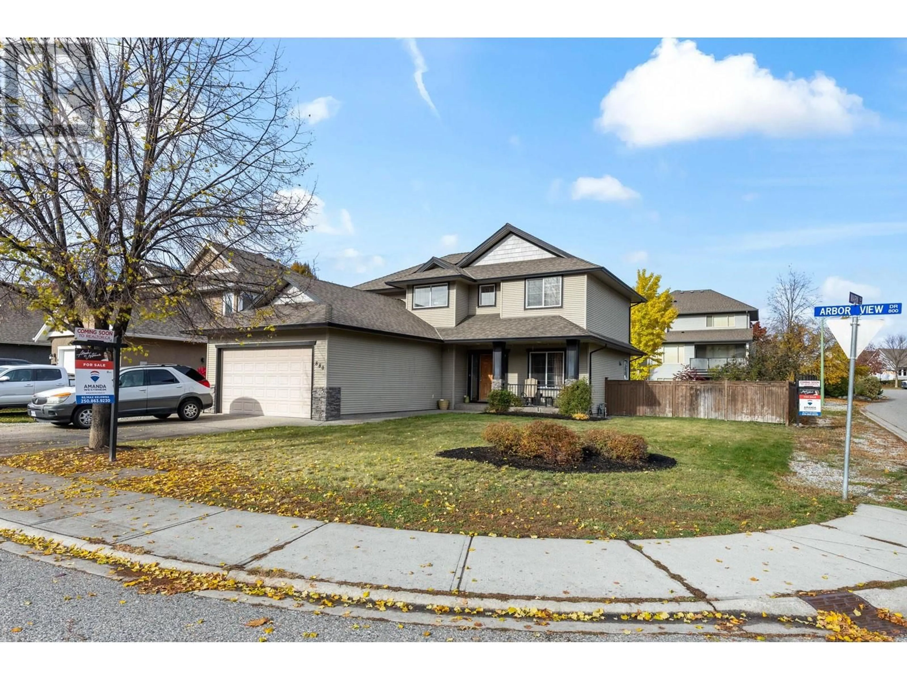 Frontside or backside of a home, the street view for 880 Arbor View Drive, Kelowna British Columbia V1W5B5